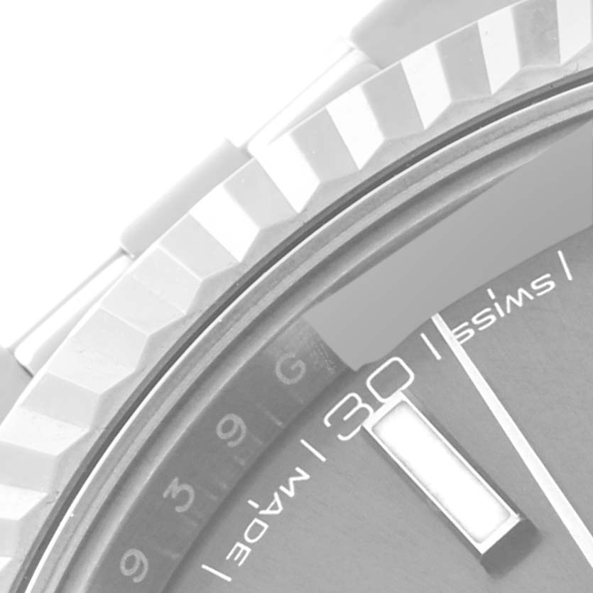 The image shows a close-up angle of the bezel and part of the dial on the Rolex Datejust 41 126334 Men
s Stainless Steel Grey Dial 126334 Men
s Stainless Steel Grey Dial model.