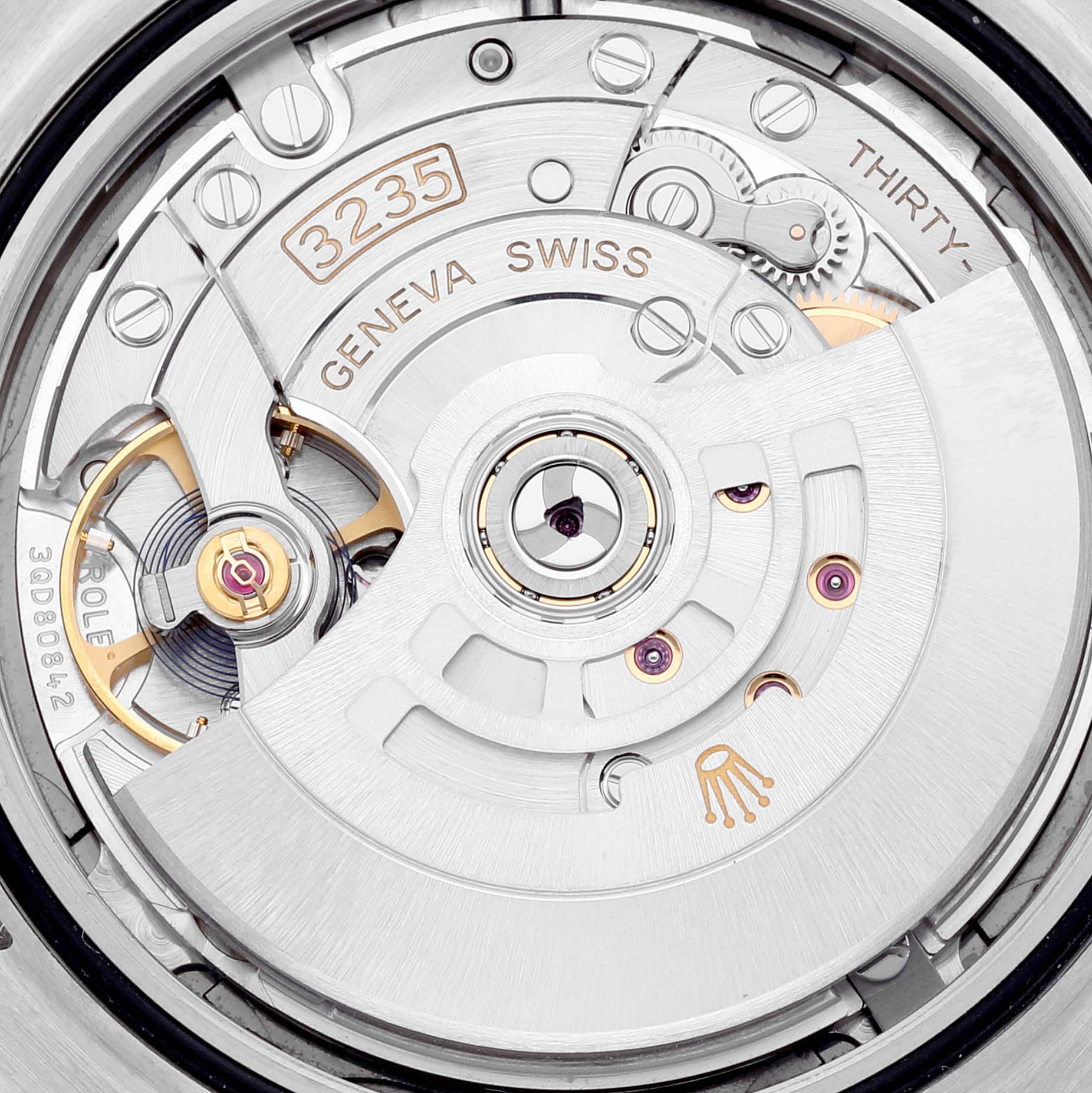 This is a close-up view of the Rolex Datejust 41 126334 Men
s Stainless Steel Grey Dial 126334 Men
s Stainless Steel Grey Dial
s movement, showcasing the intricate internal mechanics and engravings.