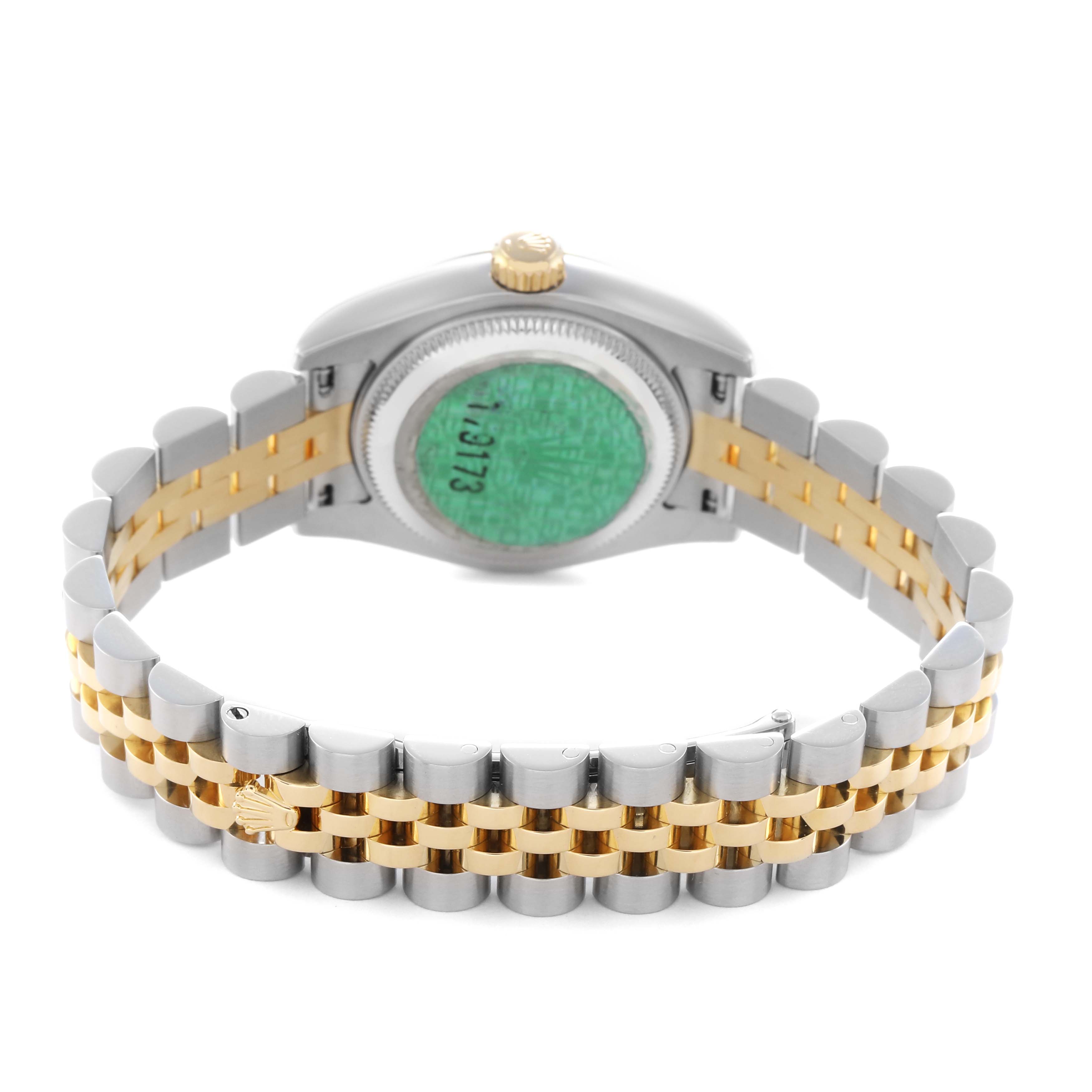 The image shows the back of a Rolex Datejust 179173 Women
s Steel and Gold (two tone) Champagne Dial 179173 Women
s Steel and Gold (two tone) Champagne Dial watch, highlighting its two-tone bracelet and case back.