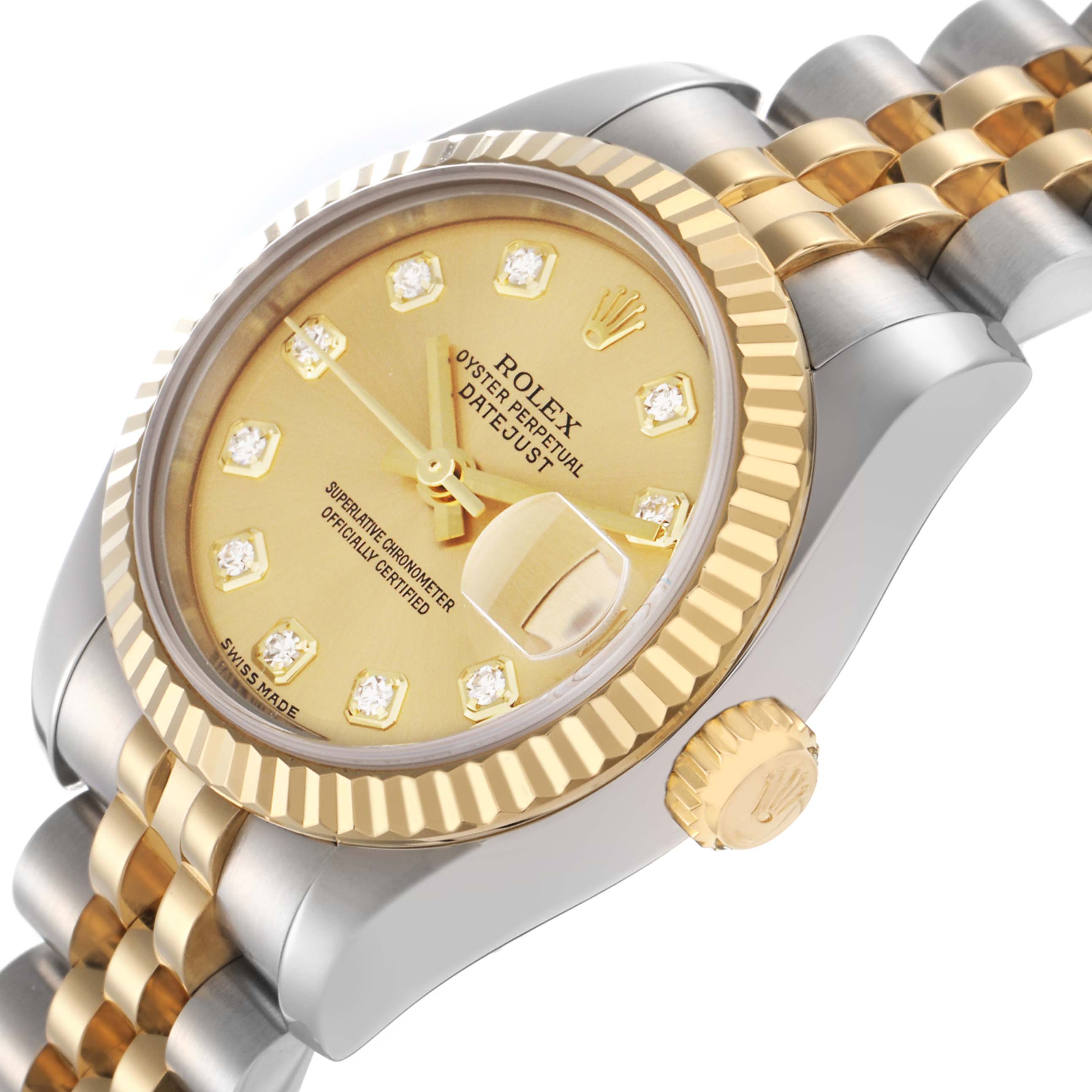 The Rolex Datejust 179173 Women
s Steel and Gold (two tone) Champagne Dial 179173 Women
s Steel and Gold (two tone) Champagne Dial watch is shown at an angled view, highlighting its two-tone bezel, dial, crown, and jubilee bracelet.