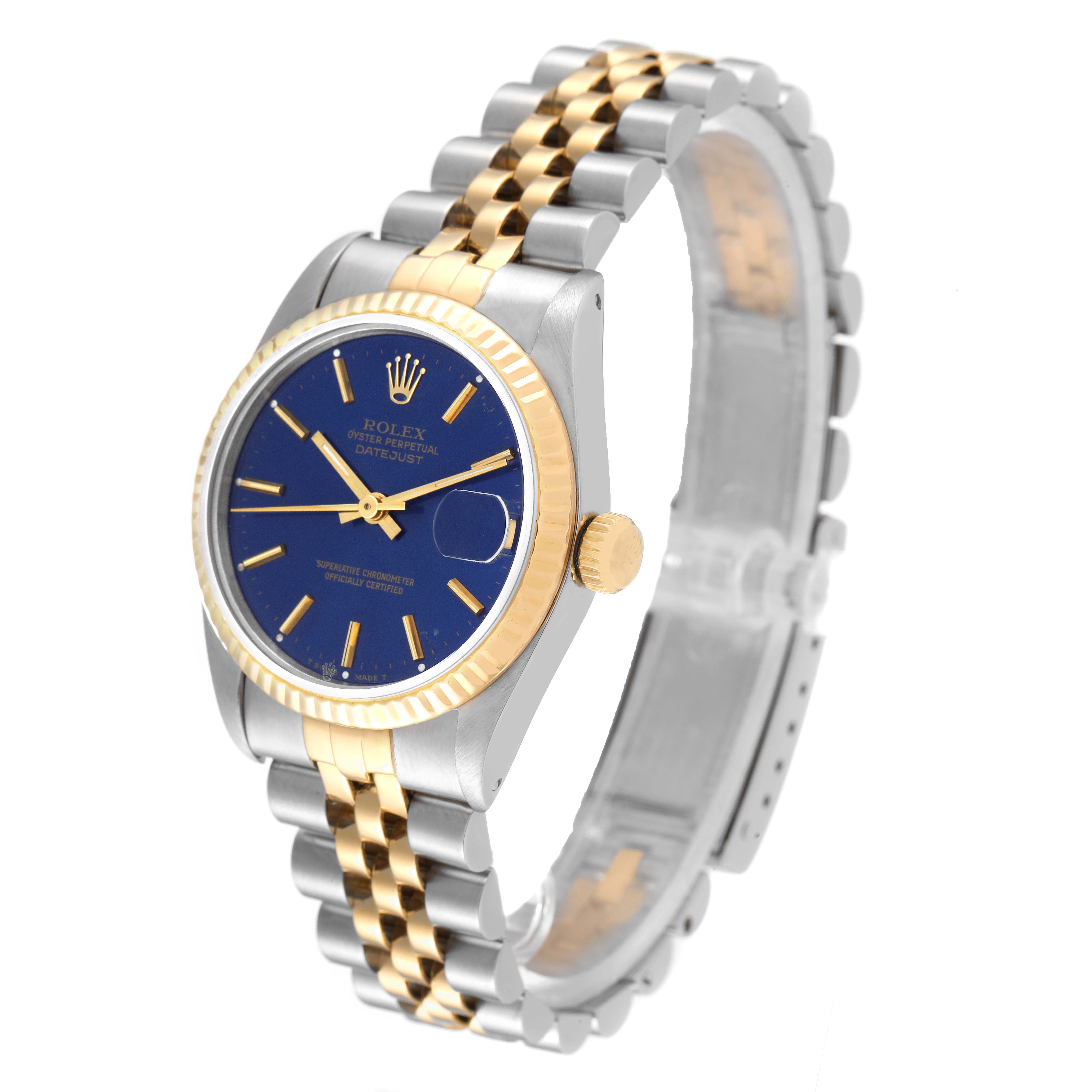 This image shows a side-angle view of a Rolex Mid-Size 68273 Women's Steel and Gold (two tone) Blue Dial 68273 Women's Steel and Gold (two tone) Blue Dial Datejust watch with a blue dial and two-tone bracelet.