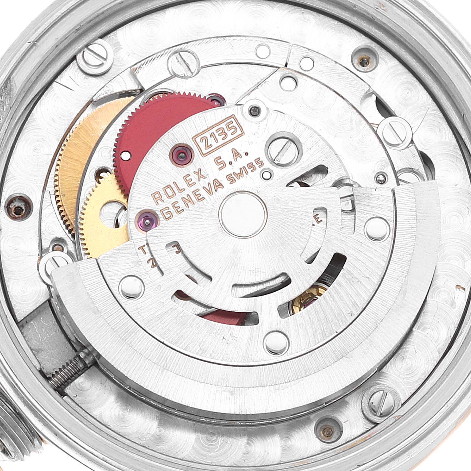The image shows the internal mechanical movement parts of a Rolex Mid-Size 68273 Women's Steel and Gold (two tone) Blue Dial 68273 Women's Steel and Gold (two tone) Blue Dial watch, including gears and the rotor, viewed from the back.