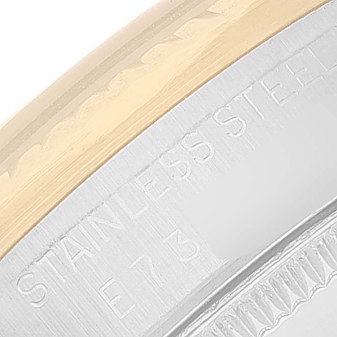 This close-up visual of the Rolex Mid-Size 68273 Women's Steel and Gold (two tone) Blue Dial 68273 Women's Steel and Gold (two tone) Blue Dial model reveals parts of the stainless steel casing and gold bezel.