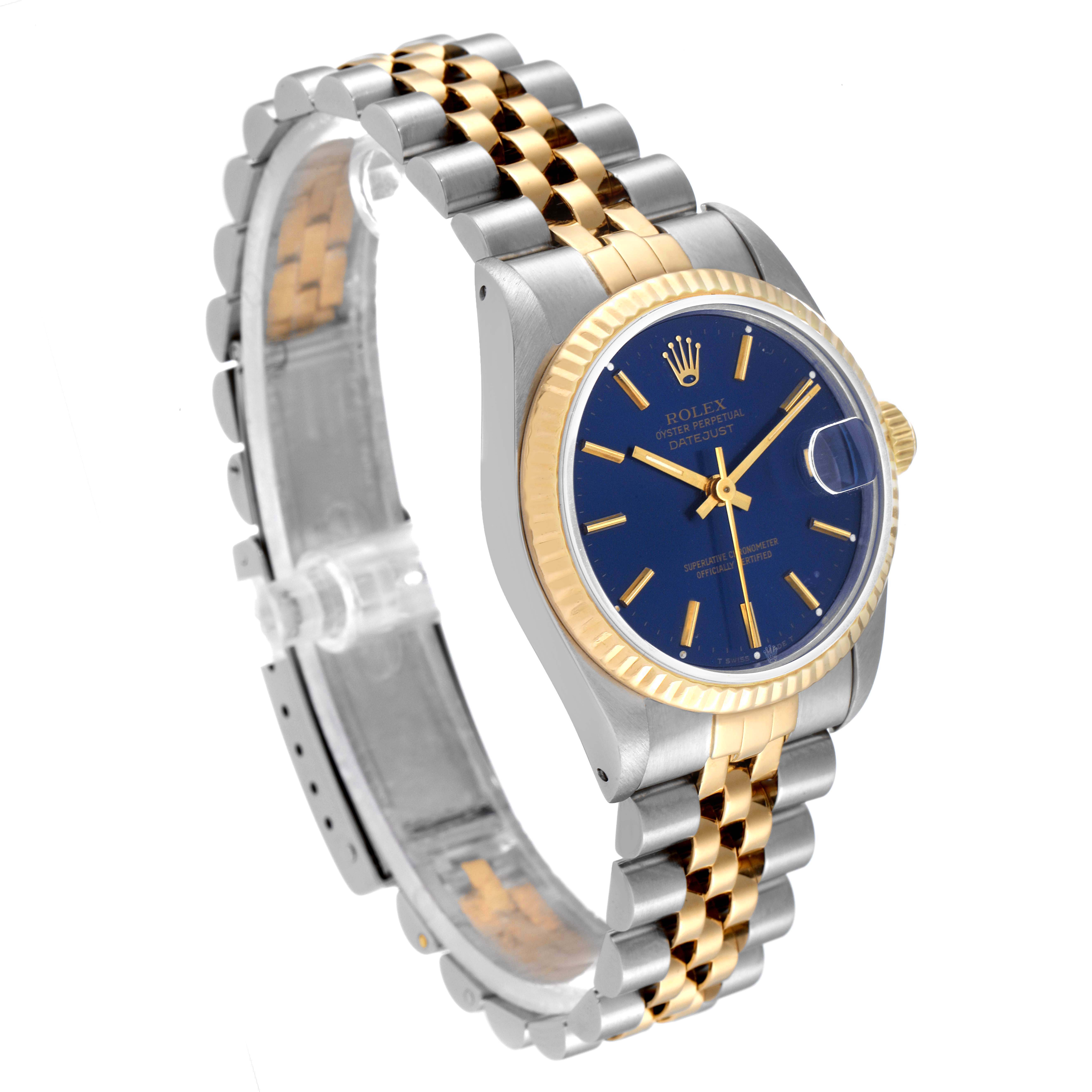 The image shows a Rolex Mid-Size 68273 Women's Steel and Gold (two tone) Blue Dial 68273 Women's Steel and Gold (two tone) Blue Dial watch angled to display its two-tone bracelet, blue dial, and fluted gold bezel.