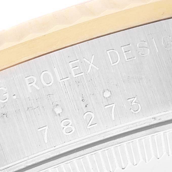 This image shows a close-up of the model number and edge of the bezel on a mid-size Rolex watch.