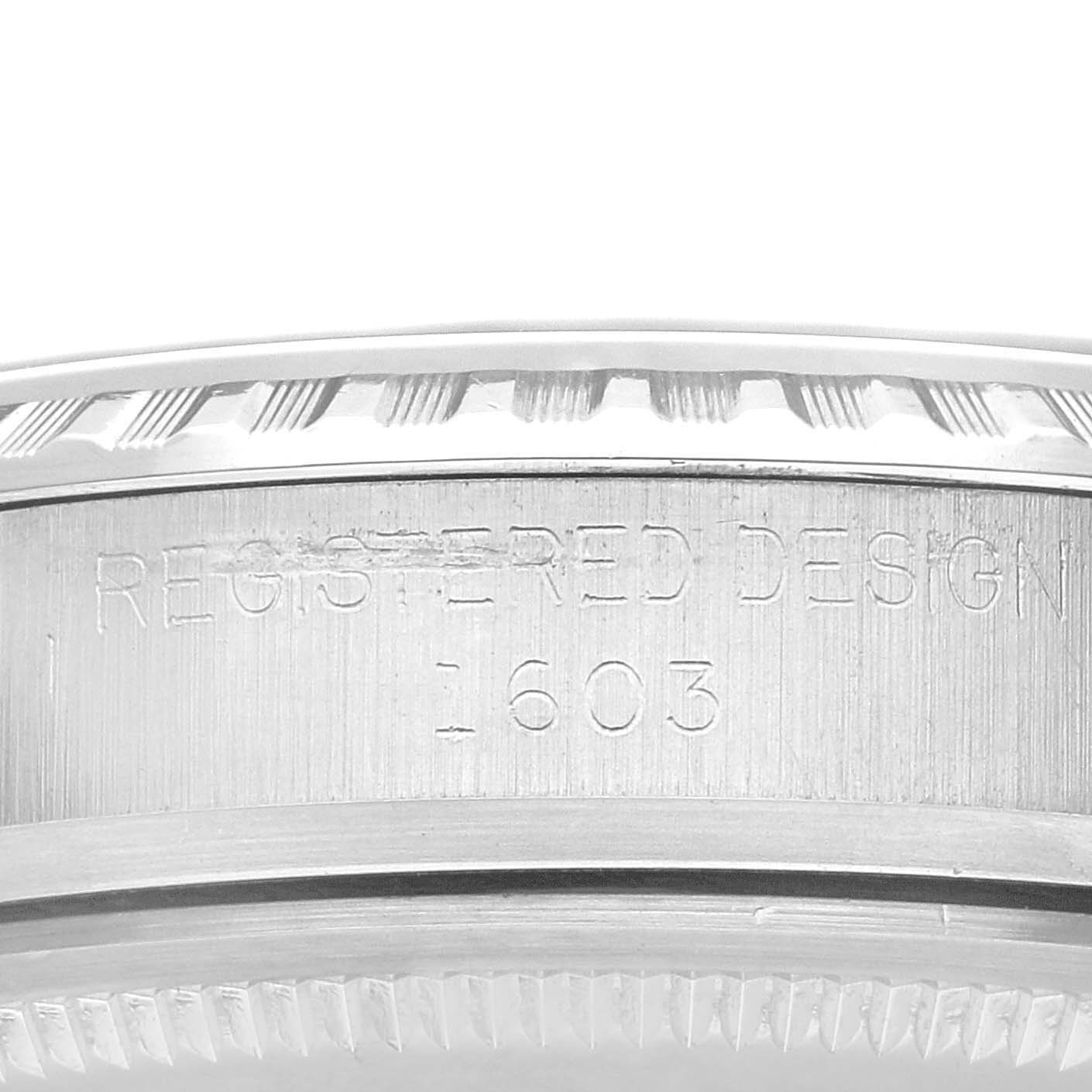 This image shows a close-up of the side view of a Rolex Vintage Collection 1603 Men's Stainless Steel Silver Dial 1603 Men's Stainless Steel Silver Dial model, highlighting its engraved details.