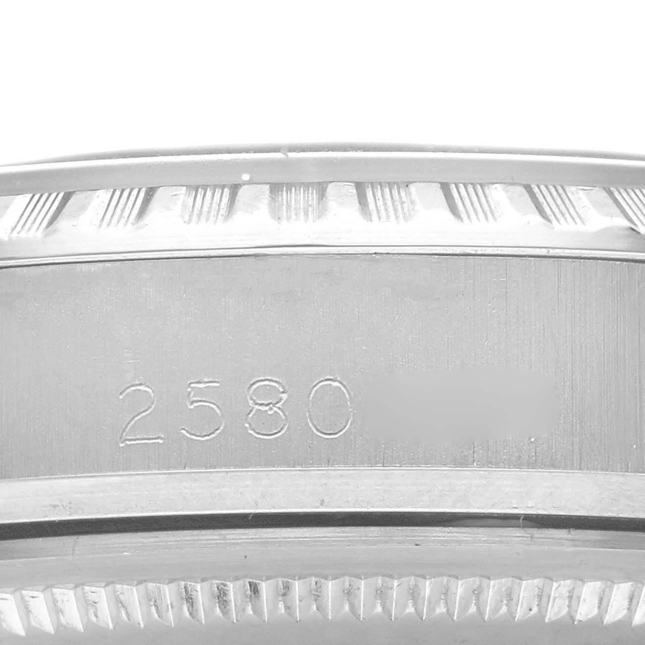 This close-up image shows the side of the casing of the Rolex Vintage Collection 1603 Men's Stainless Steel Silver Dial 1603 Men's Stainless Steel Silver Dial watch, highlighting the serial number.