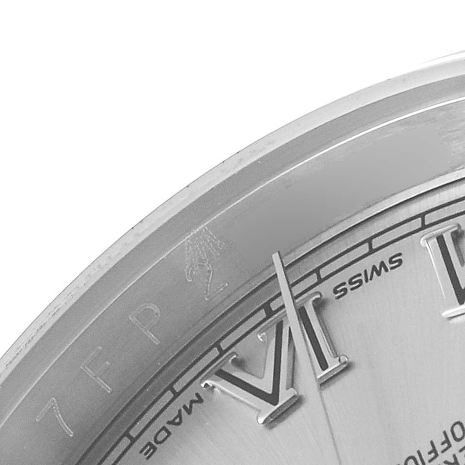 This image shows a close-up of the dial and Roman numeral hour markers of a Rolex Datejust 116200 Men's Stainless Steel Silver Dial 116200 Men's Stainless Steel Silver Dial watch from an angled perspective.