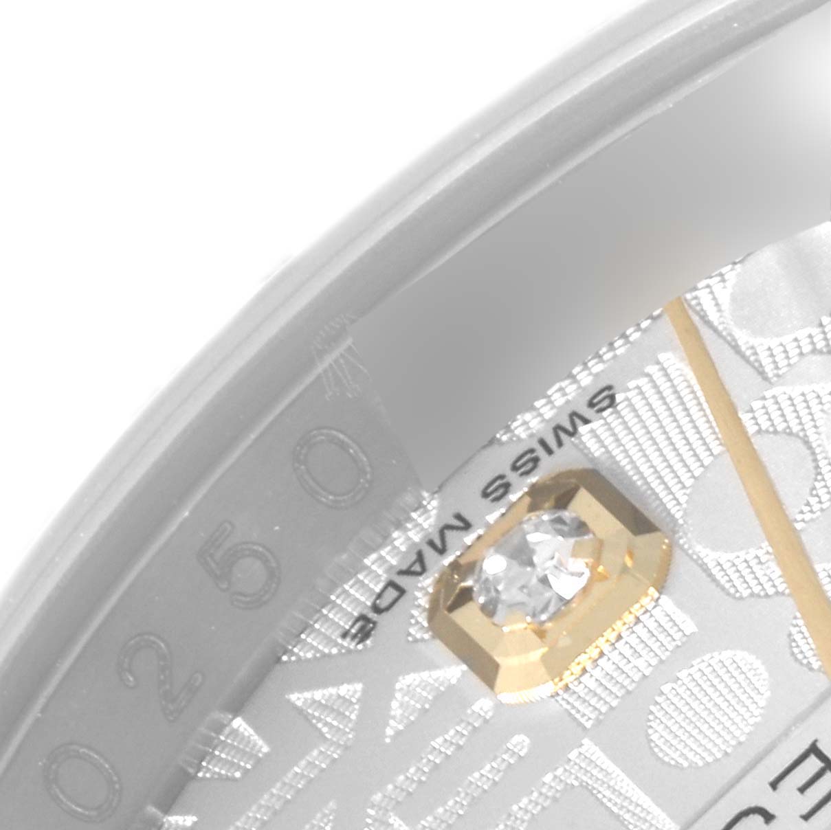 This close-up image of a Rolex Datejust 116243 Men's Steel and Gold (two tone) Silver Dial 116243 Men's Steel and Gold (two tone) Silver Dial watch shows part of the dial with a diamond hour marker and "Swiss Made" text.