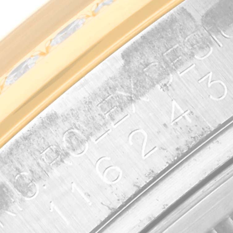 The image shows a close-up of the case and bezel edge of a Rolex Datejust 116243 Men's Steel and Gold (two tone) Silver Dial 116243 Men's Steel and Gold (two tone) Silver Dial watch.