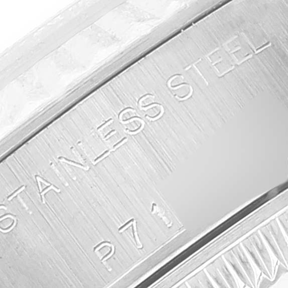 The image shows a close-up angle of the case edge of a Rolex Datejust 79174 Women
s Stainless Steel Blue Dial 79174 Women
s Stainless Steel Blue Dial, focusing on the stainless steel engraving.