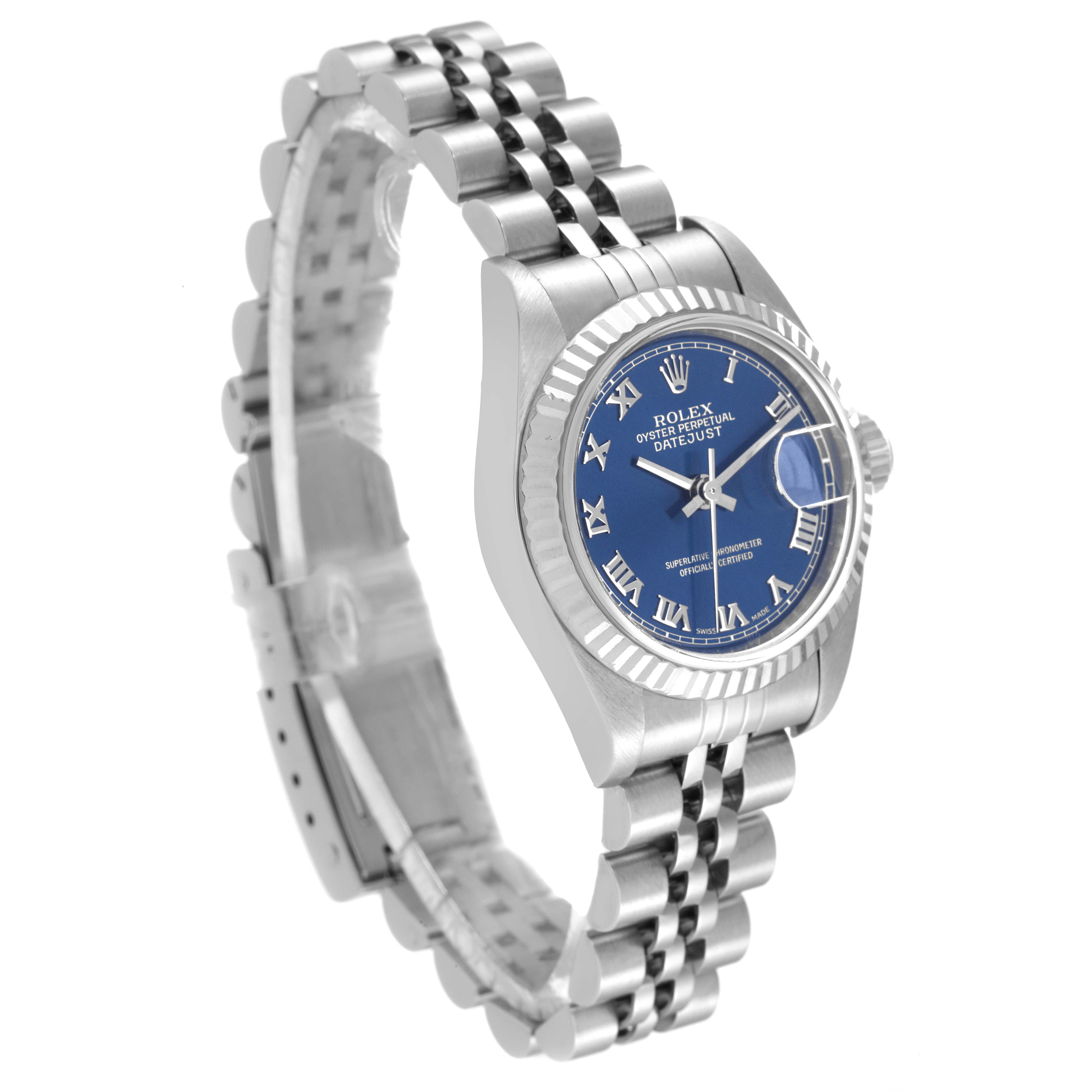 The image shows a Rolex Datejust 79174 Women
s Stainless Steel Blue Dial 79174 Women
s Stainless Steel Blue Dial watch from a three-quarter angle, revealing its face, bezel, and Jubilee bracelet.