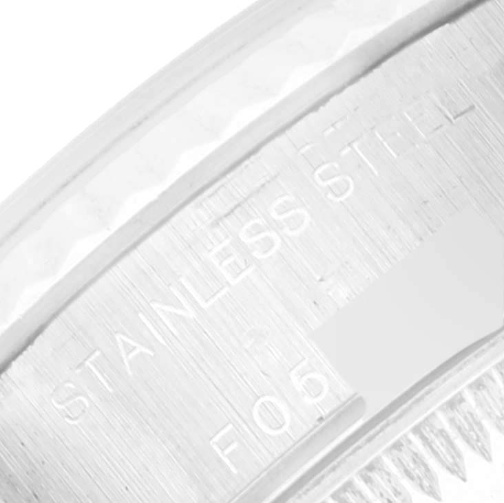 The image shows a close-up of the side of a Rolex Datejust 79174 Women's Stainless Steel Mother of Pearl Dial 79174 Women's Stainless Steel Mother of Pearl Dial watch, highlighting the "Stainless Steel" engraving.
