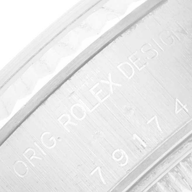 The image shows a close-up of the engraved numbers and "ORIG. ROLEX DESIGN" on the side of a Rolex Datejust 79174 Women's Stainless Steel Mother of Pearl Dial 79174 Women's Stainless Steel Mother of Pearl Dial watch case.