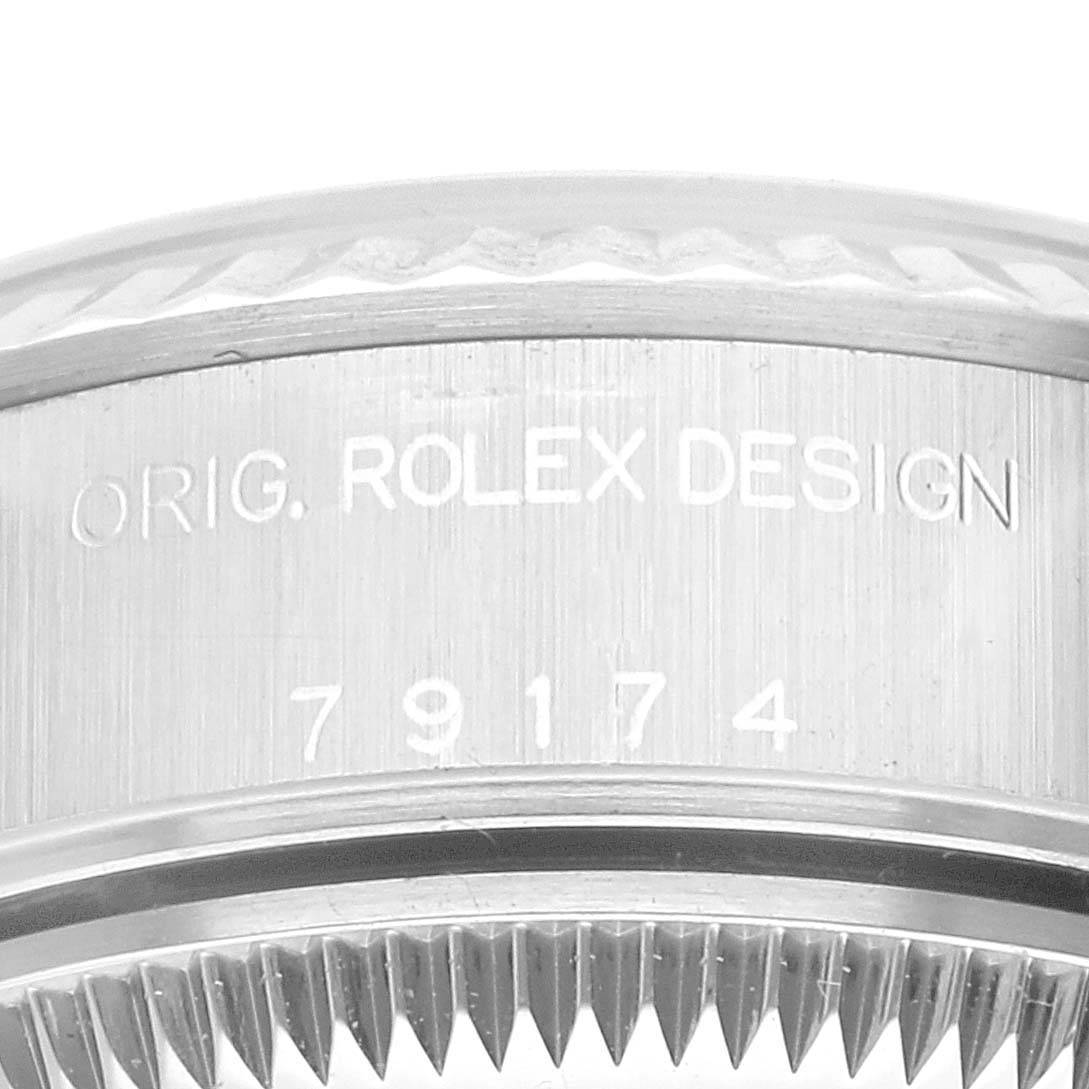 Close-up view of the side of a Rolex Datejust 79174 Women's Stainless Steel White Dial 79174 Women's Stainless Steel White Dial case with the model number and bezel teeth visible.