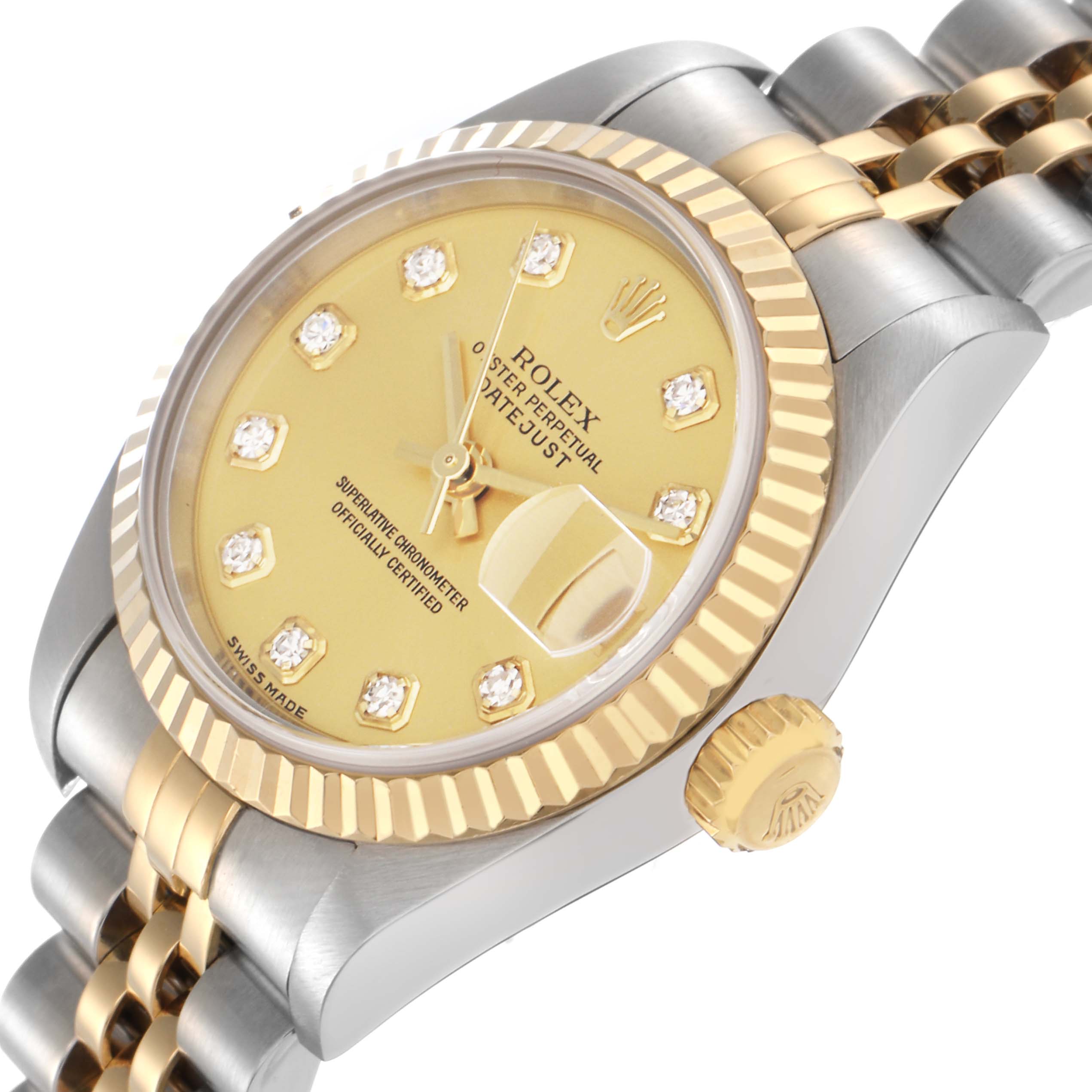 The Rolex Datejust 79173 Women
s Steel and Gold (two tone) Champagne Dial 79173 Women
s Steel and Gold (two tone) Champagne Dial watch is shown at a slight side angle, highlighting the face, fluted bezel, crown, and bi-metal bracelet.