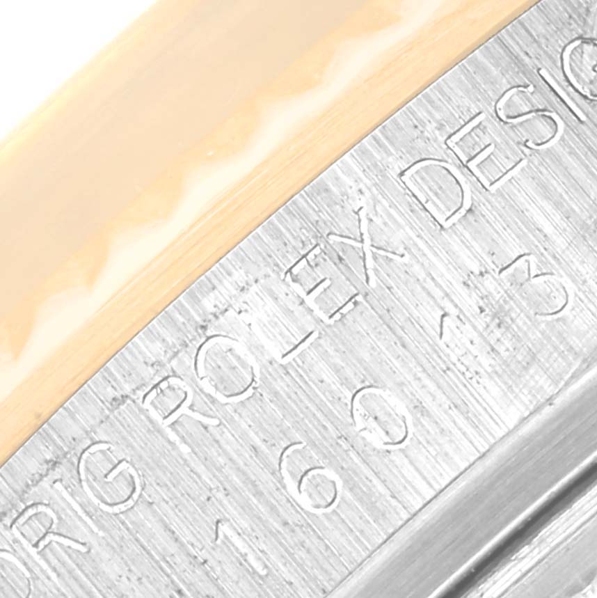 The image shows a close-up of the side casing with engravings of a Vintage Collection model by Rolex.