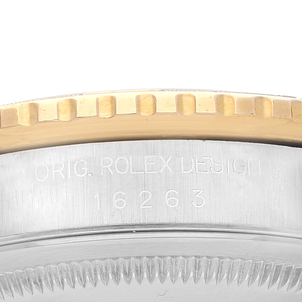 The image shows a close-up angle of the bezel and side of the case with the engraved model number of a Rolex Turn-o-Graph 16263 Men
s Steel and Gold (two tone) Champagne Dial 16263 Men
s Steel and Gold (two tone) Champagne Dial watch.