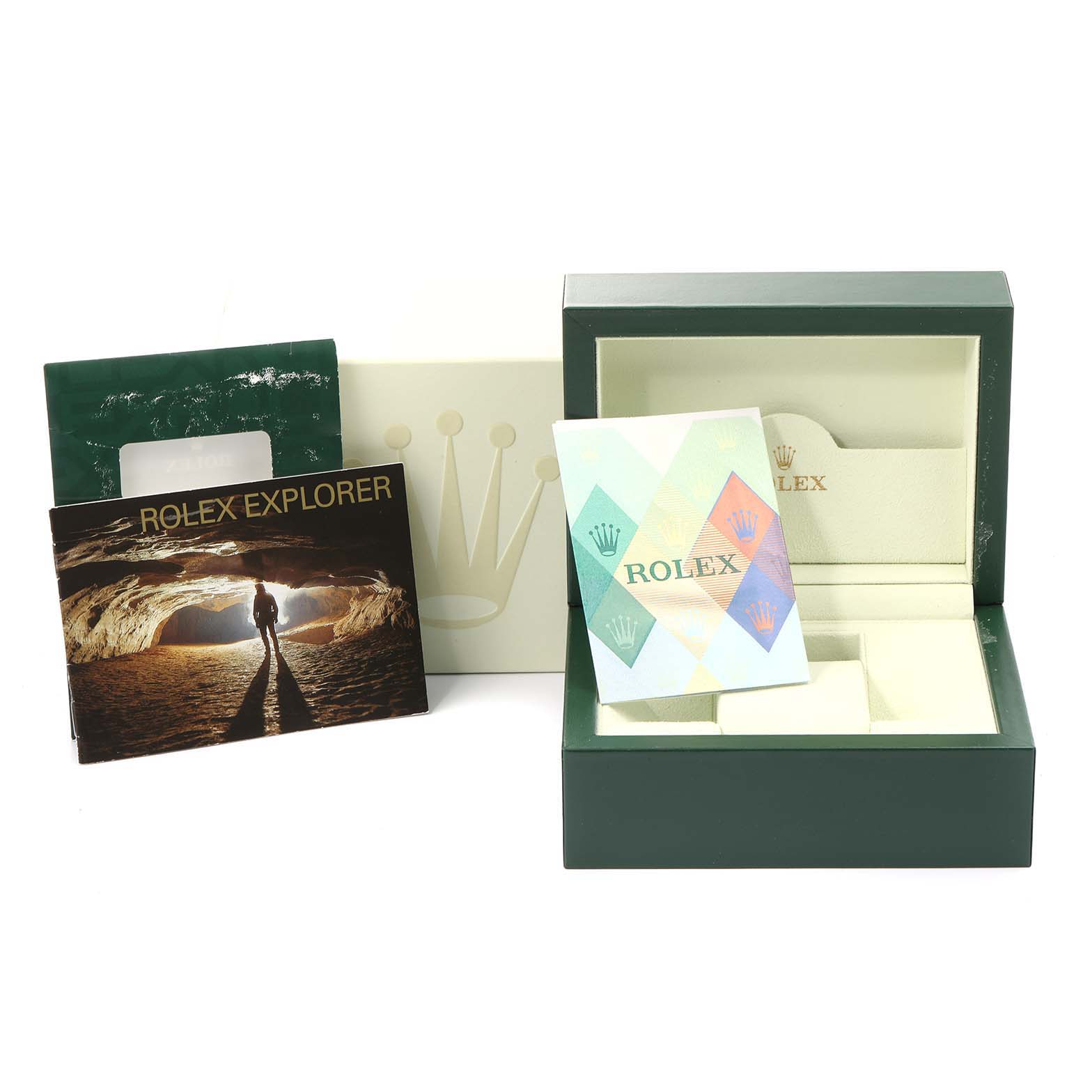 This image shows the packaging and manuals for a Rolex Explorer 16570 Men
s Stainless Steel White Dial 16570 Men
s Stainless Steel White Dial watch, including the box, case, and informational booklets.