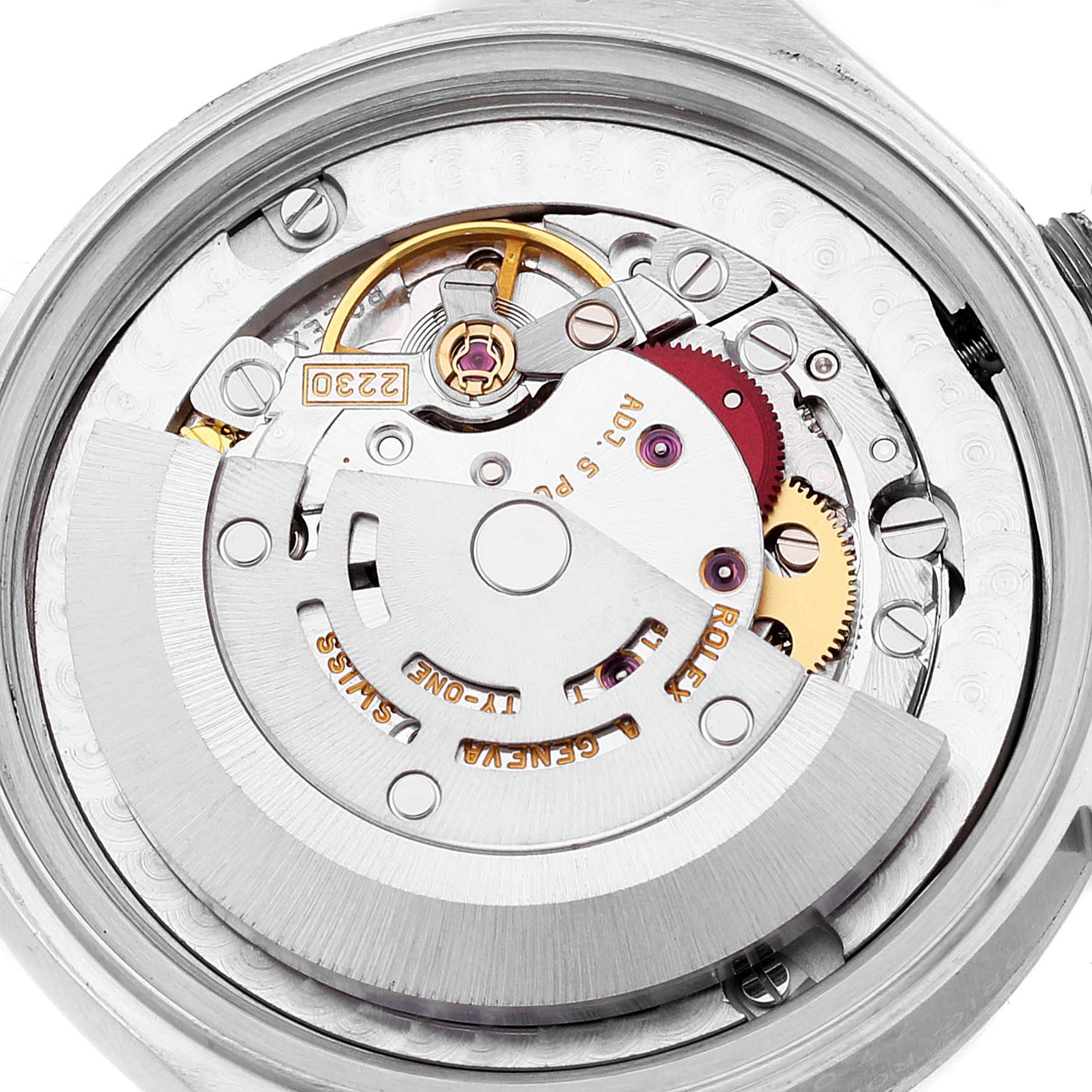 This image shows a close-up of the internal movement and gears of a Mid-Size Rolex watch from a top angle.