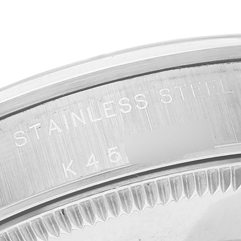 This image shows a close-up of the stainless steel case back of a Rolex Mid-Size 77080 Women
s Stainless Steel Silver Dial 77080 Women
s Stainless Steel Silver Dial watch.