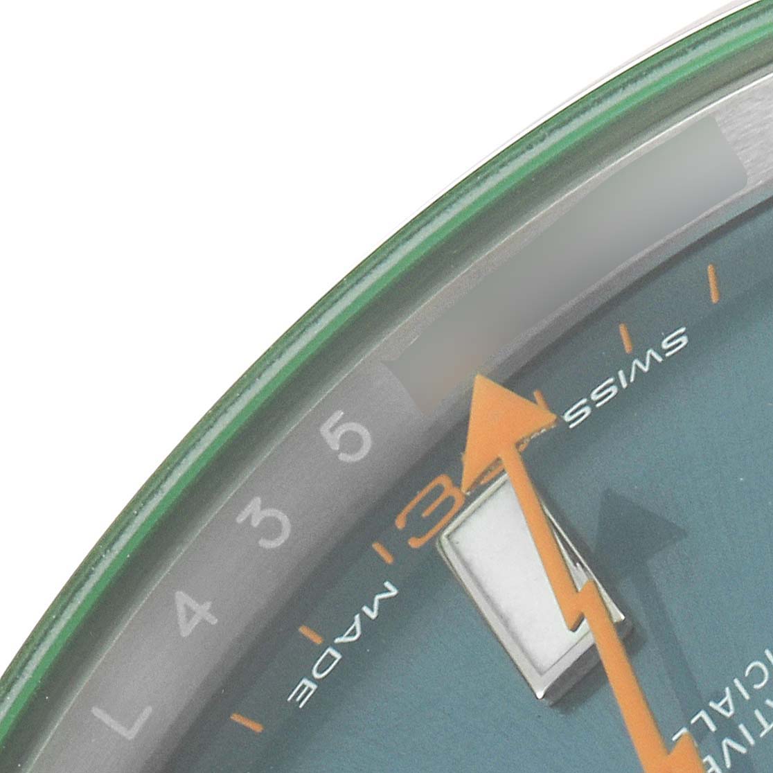 The image shows a close-up of the Rolex Milgauss 116400GV Men's Stainless Steel Blue Dial 116400GV Men's Stainless Steel Blue Dial watch dial, highlighting the orange lightning bolt second hand and partial numbers.