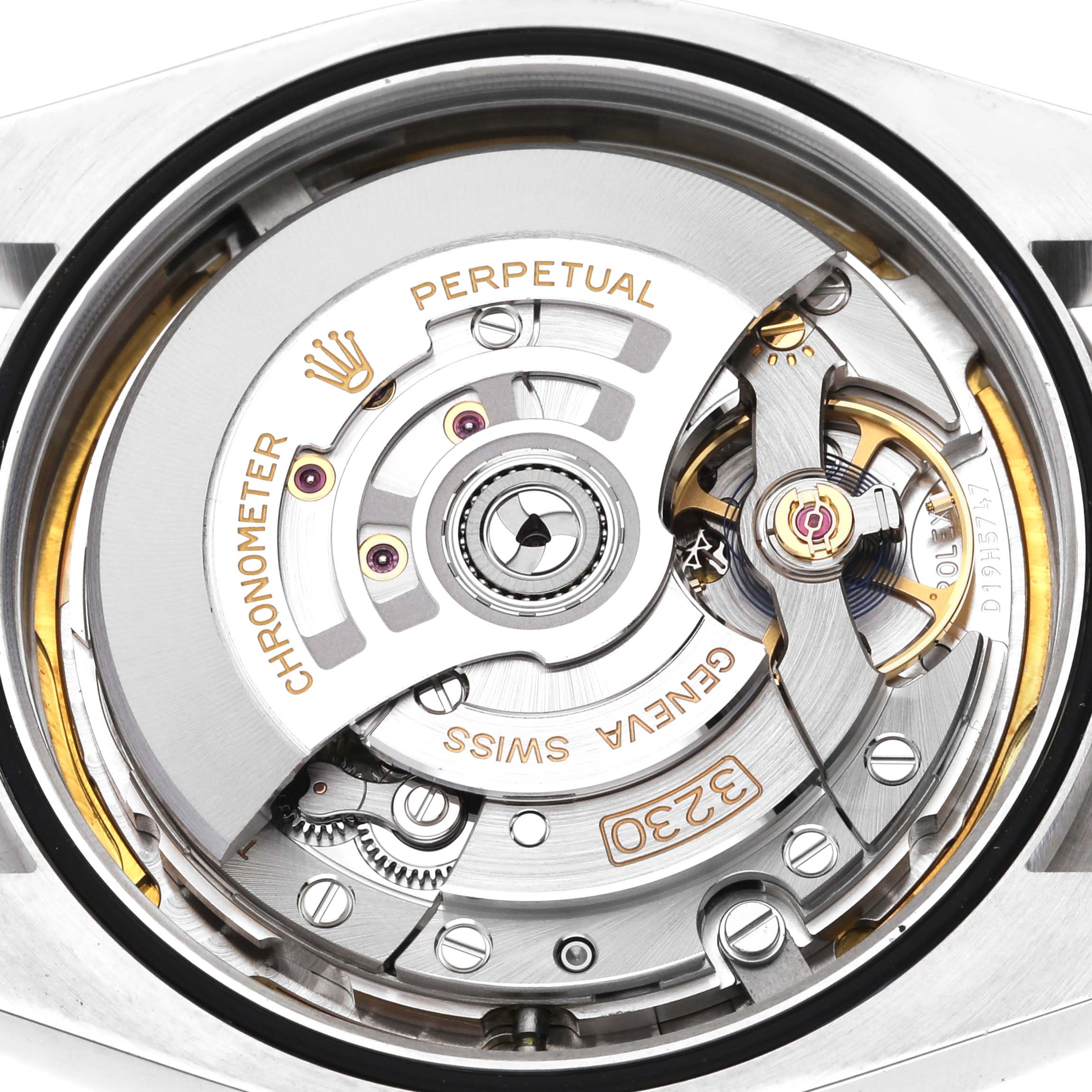 The image shows a close-up view of the movement of a Rolex Oyster Perpetual 124300 Men's Stainless Steel Green Dial 124300 Men's Stainless Steel Green Dial watch, highlighting internal components and engravings.