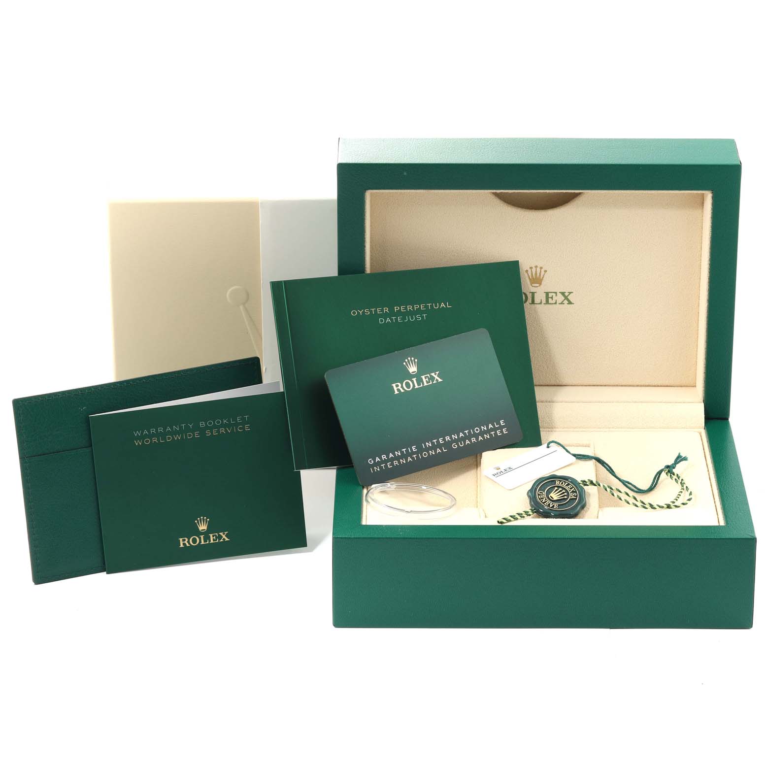 The image shows the packaging and documentation for the Rolex Oyster Perpetual 124300 Men's Stainless Steel Green Dial 124300 Men's Stainless Steel Green Dial model, including booklets, warranty card, and the box.