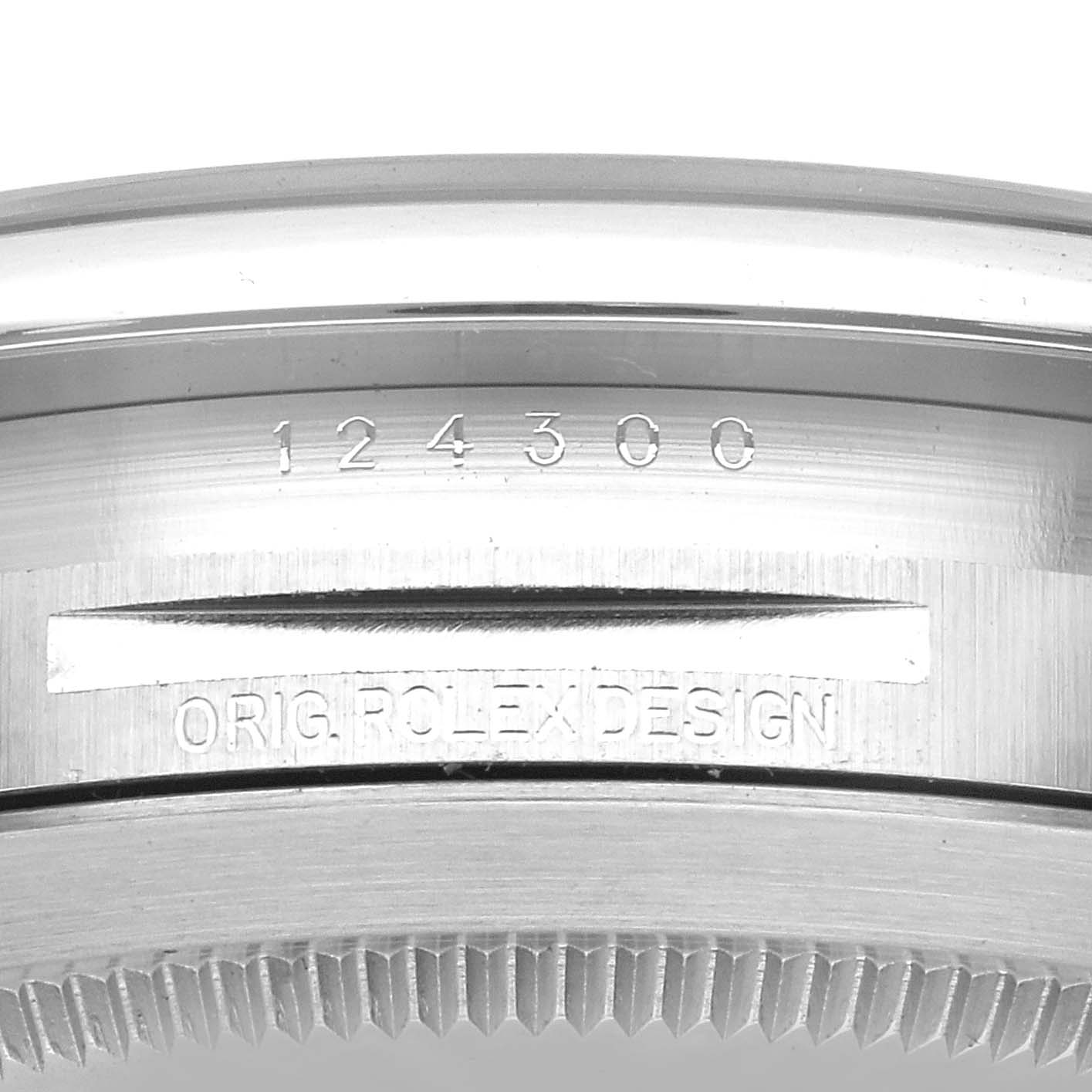 This image shows a close-up of the case back from the side of the Rolex Oyster Perpetual 124300 Men's Stainless Steel Green Dial 124300 Men's Stainless Steel Green Dial watch, featuring its model number and design engraving.