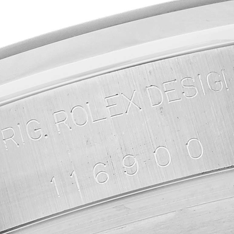This close-up image of the Rolex Air-King 116900 Men's Stainless Steel Black Dial 116900 Men's Stainless Steel Black Dial watch shows the model number and "ROLEX DESIGN" engraving on the case.