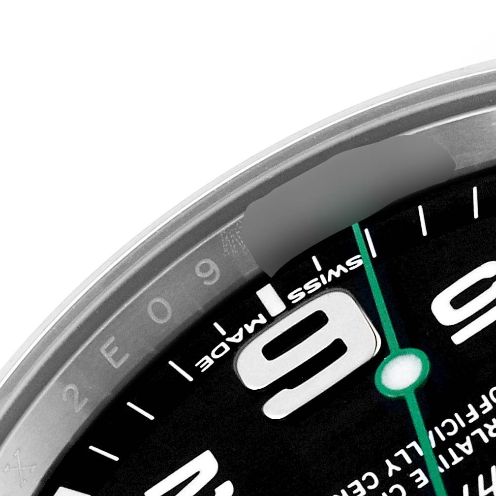 This image shows a close-up angle of the dial, bezel, and part of the "9" hour marker on the Rolex Air-King 116900 Men's Stainless Steel Black Dial 116900 Men's Stainless Steel Black Dial.