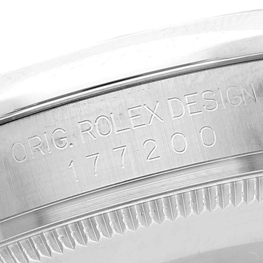 The image shows a close-up of the model number engraving on the side of a Mid-Size Rolex watch case.