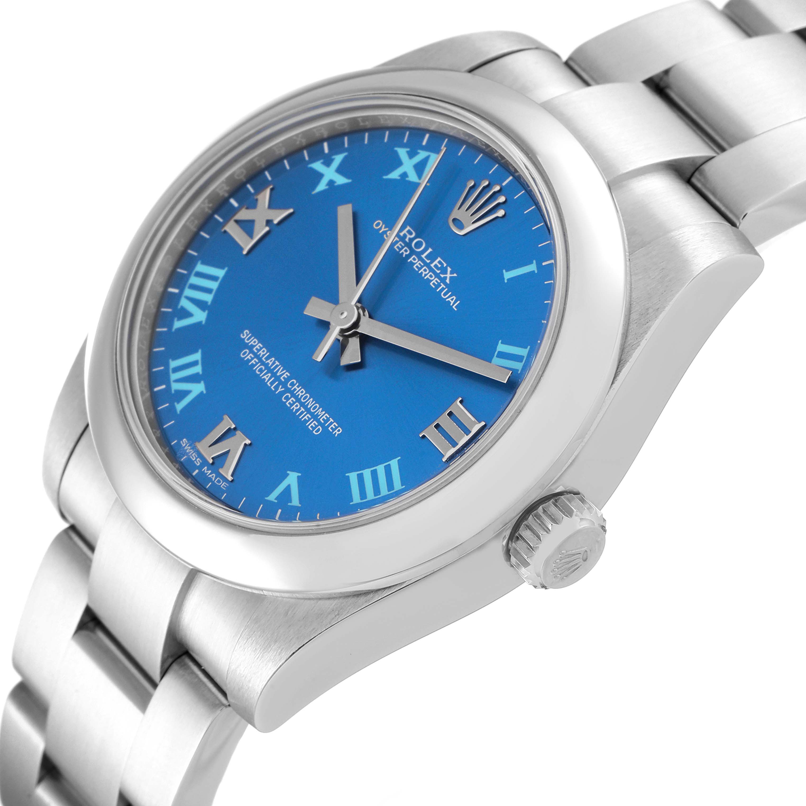 The image shows a side-angle view of a Rolex Mid-Size 177200 Women
s Stainless Steel Blue Dial 177200 Women
s Stainless Steel Blue Dial watch, highlighting the blue dial, crown, and part of the metal bracelet.