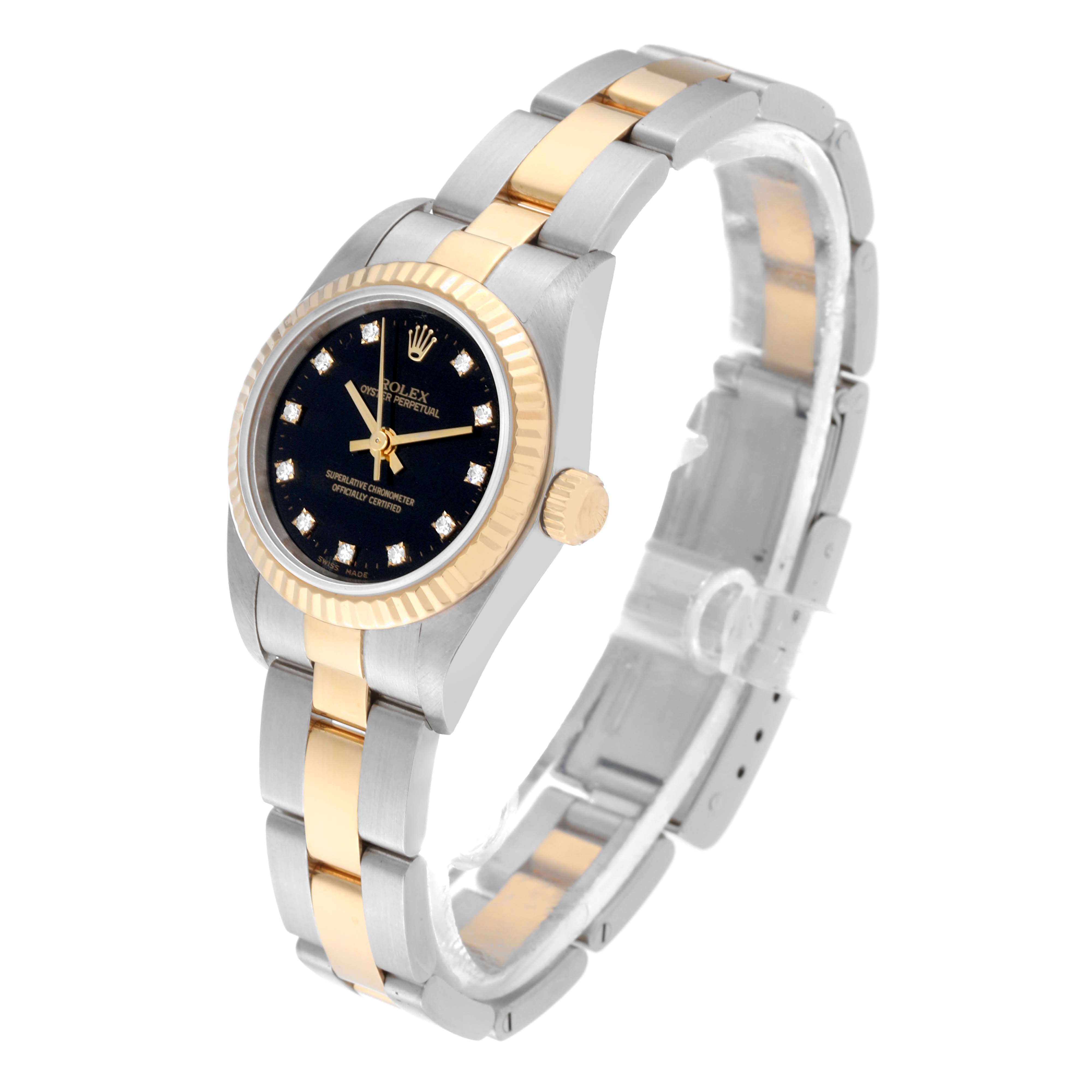 The image shows a Rolex Oyster Perpetual 76193 Women's Steel and Gold (two tone) Black Dial 76193 Women's Steel and Gold (two tone) Black Dial watch at a slight angle, highlighting its black dial, gold bezel, and two-tone metal bracelet.