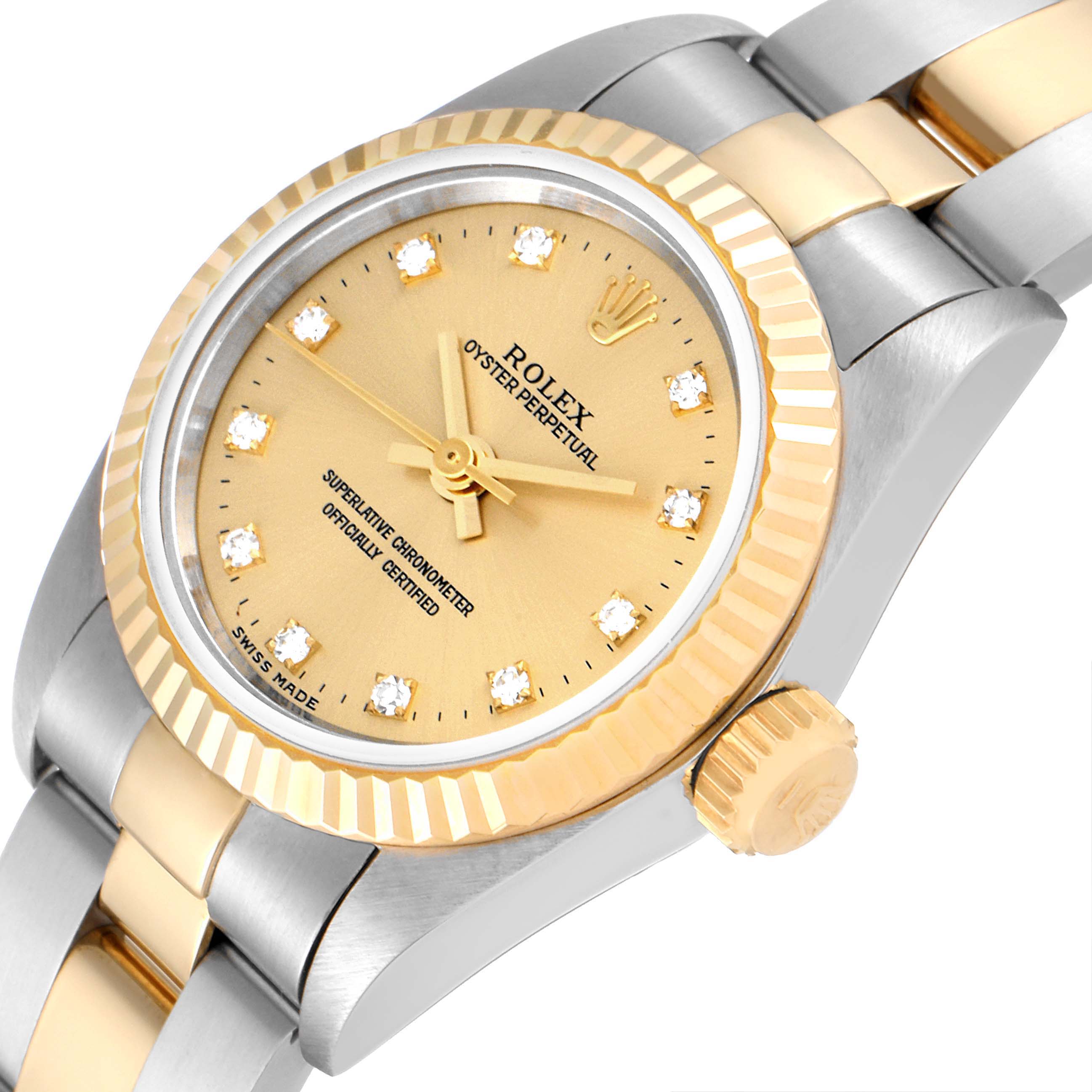 The image shows a close-up angled view of the Rolex Oyster Perpetual 67193 Women
s Steel and Gold (two tone) Champagne Dial 67193 Women
s Steel and Gold (two tone) Champagne Dial watch, highlighting the dial, bezel, and part of the bracelet.