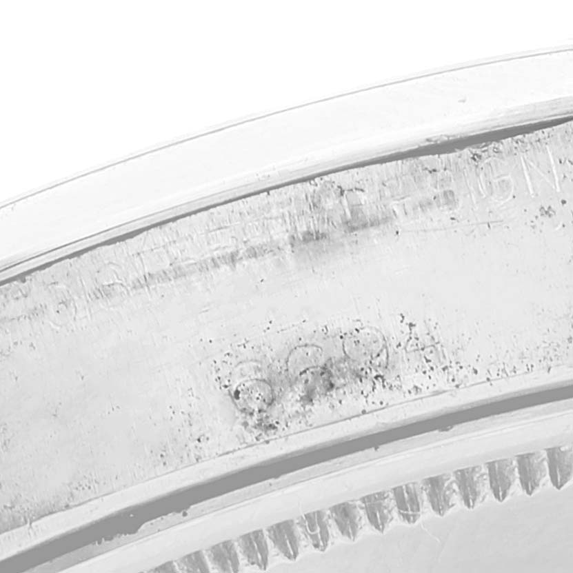 This image shows a close-up view of the inner casing and partial serial number of a Rolex Date 6694 Men's Stainless Steel Black Dial 6694 Men's Stainless Steel Black Dial model watch.