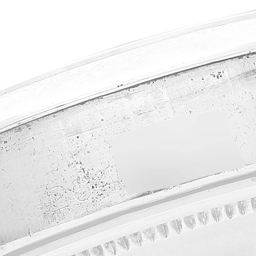 This image shows a close-up view of the inner bezel and part of the edge of the case for a Rolex Date 6694 Men's Stainless Steel Black Dial 6694 Men's Stainless Steel Black Dial model watch.