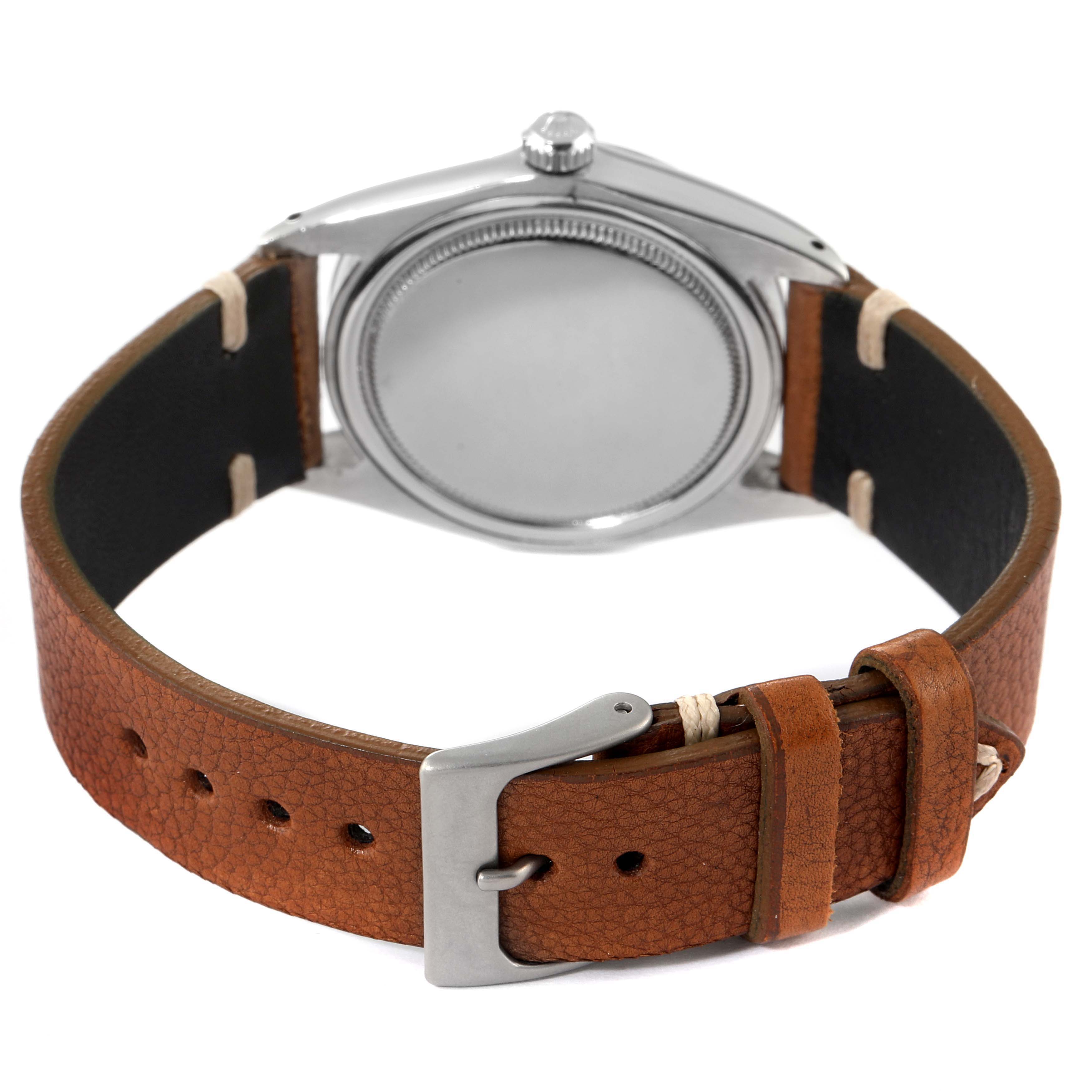 The image shows the back of a Rolex Date 6694 Men's Stainless Steel Black Dial 6694 Men's Stainless Steel Black Dial model watch, featuring a leather strap and buckle.