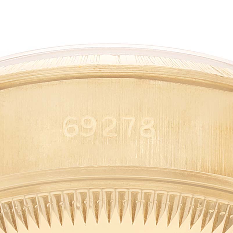 This image shows a close-up of the Rolex President 69278 Women
s Yellow Gold Champagne Dial 69278 Women
s Yellow Gold Champagne Dial model
s case side, revealing its reference number "69278."