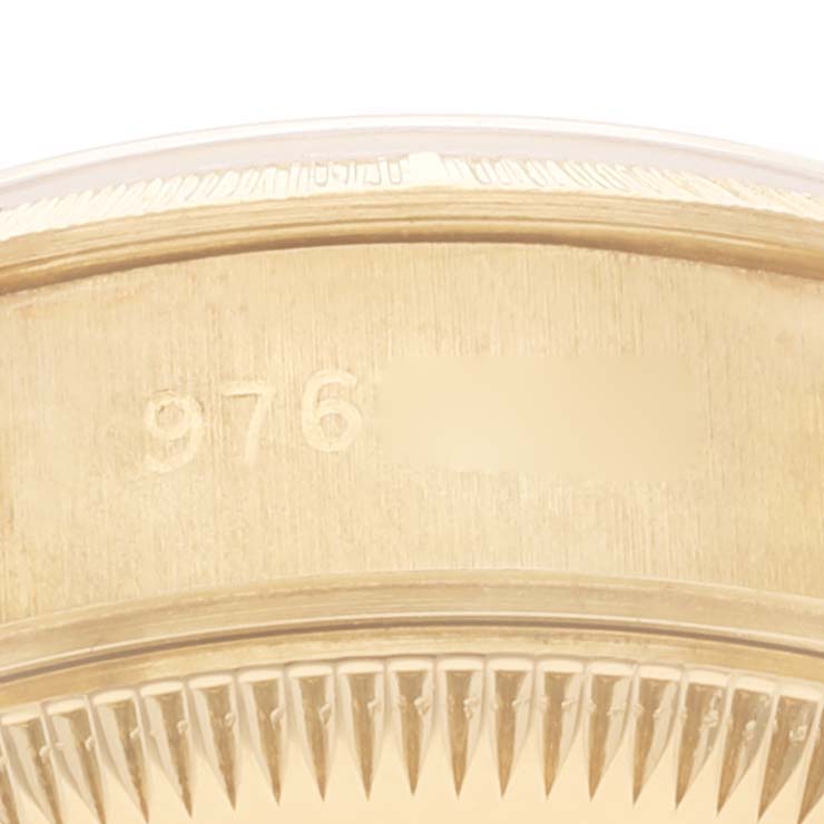 This close-up image shows the serial number on the caseback edge of a Rolex President 69278 Women
s Yellow Gold Champagne Dial 69278 Women
s Yellow Gold Champagne Dial model watch.