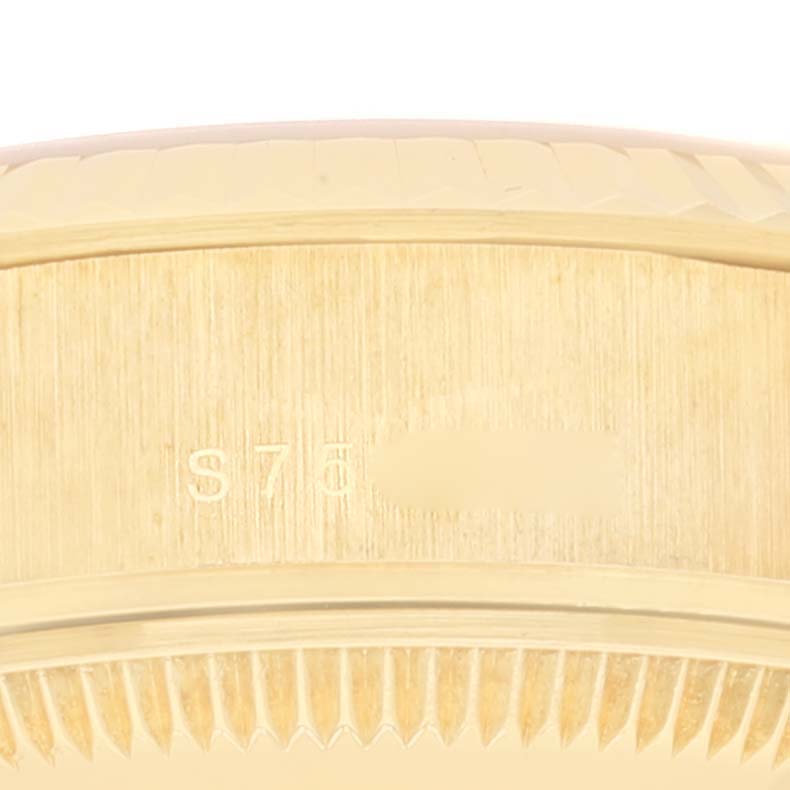 The image shows a close-up of the side and fluted bezel of a Rolex President 69178 Women
s Yellow Gold Champagne Dial 69178 Women
s Yellow Gold Champagne Dial model watch.