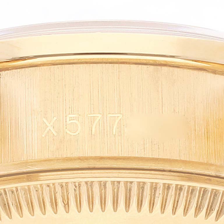 The image shows a close-up of the side of the case and bezel detail of a Rolex President 69158 Women's Yellow Gold Blue Dial 69158 Women's Yellow Gold Blue Dial model watch.