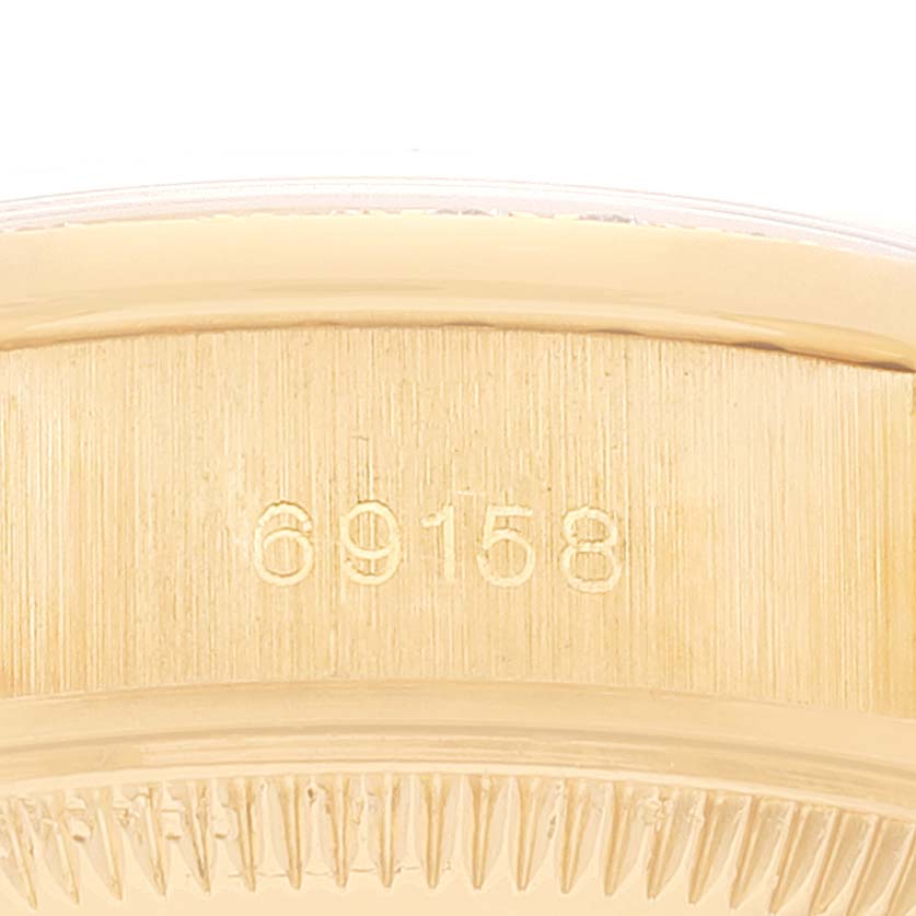 This image shows a close-up of the case side, part of the Rolex President 69158 Women's Yellow Gold Blue Dial 69158 Women's Yellow Gold Blue Dial model, displaying the model number "69158."