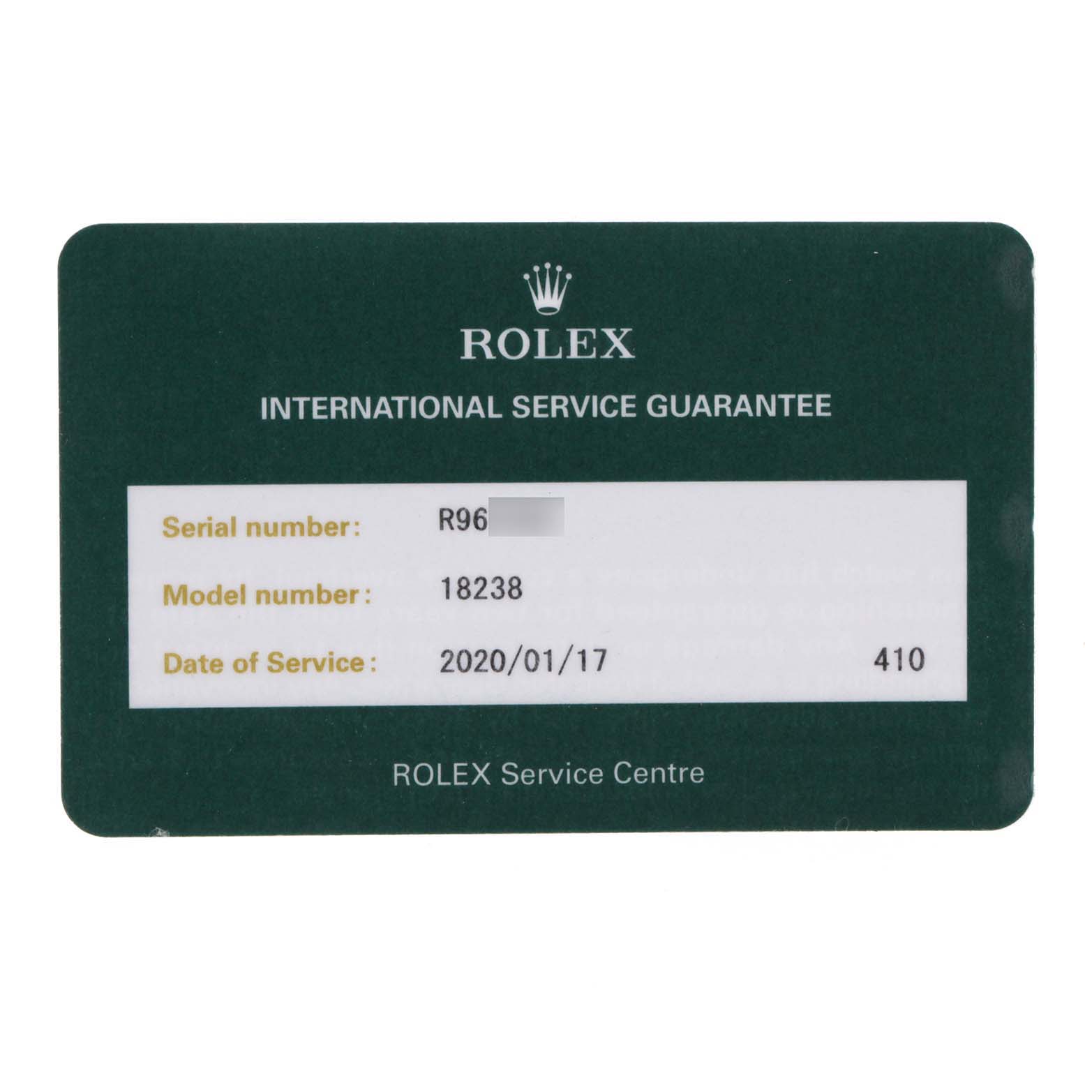 This image shows the front of a green Rolex International Service Guarantee card for a President model, number 18238.