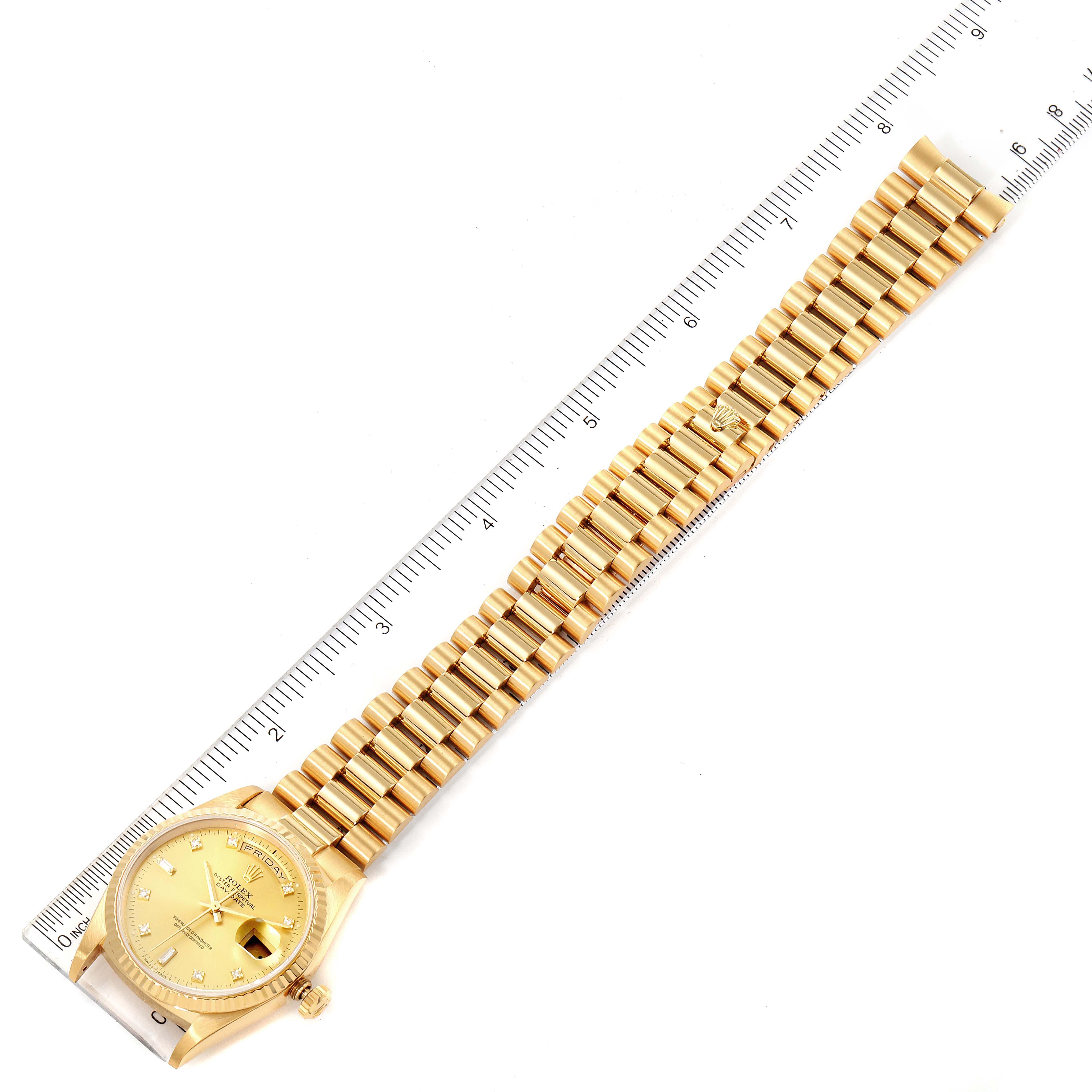 The image shows a Rolex President 18238 Men's Yellow Gold Champagne Dial 18238 Men's Yellow Gold Champagne Dial model watch laid flat with a ruler for scale, displaying the entire watch and bracelet.