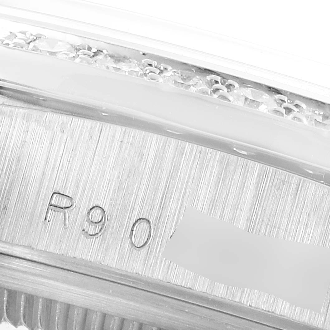 This image shows a close-up of the engraving and part of the bezel on a Rolex President 18346 Men's Platinum Silver Dial 18346 Men's Platinum Silver Dial model watch.