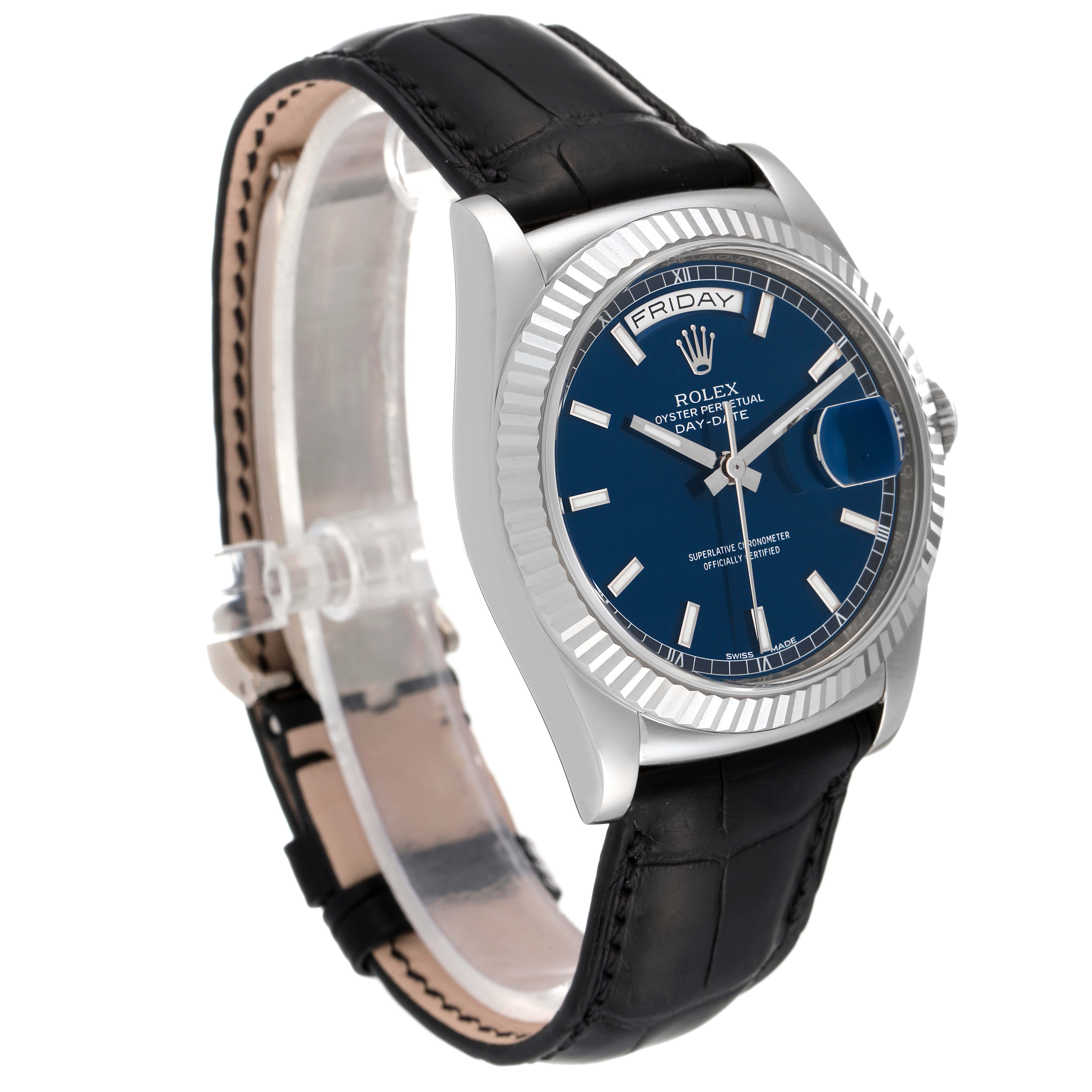 The image shows a side angle of a Rolex President 118139 Men's Stainless Steel Blue Dial 118139 Men's Stainless Steel Blue Dial model watch featuring a blue dial, fluted bezel, and leather strap.