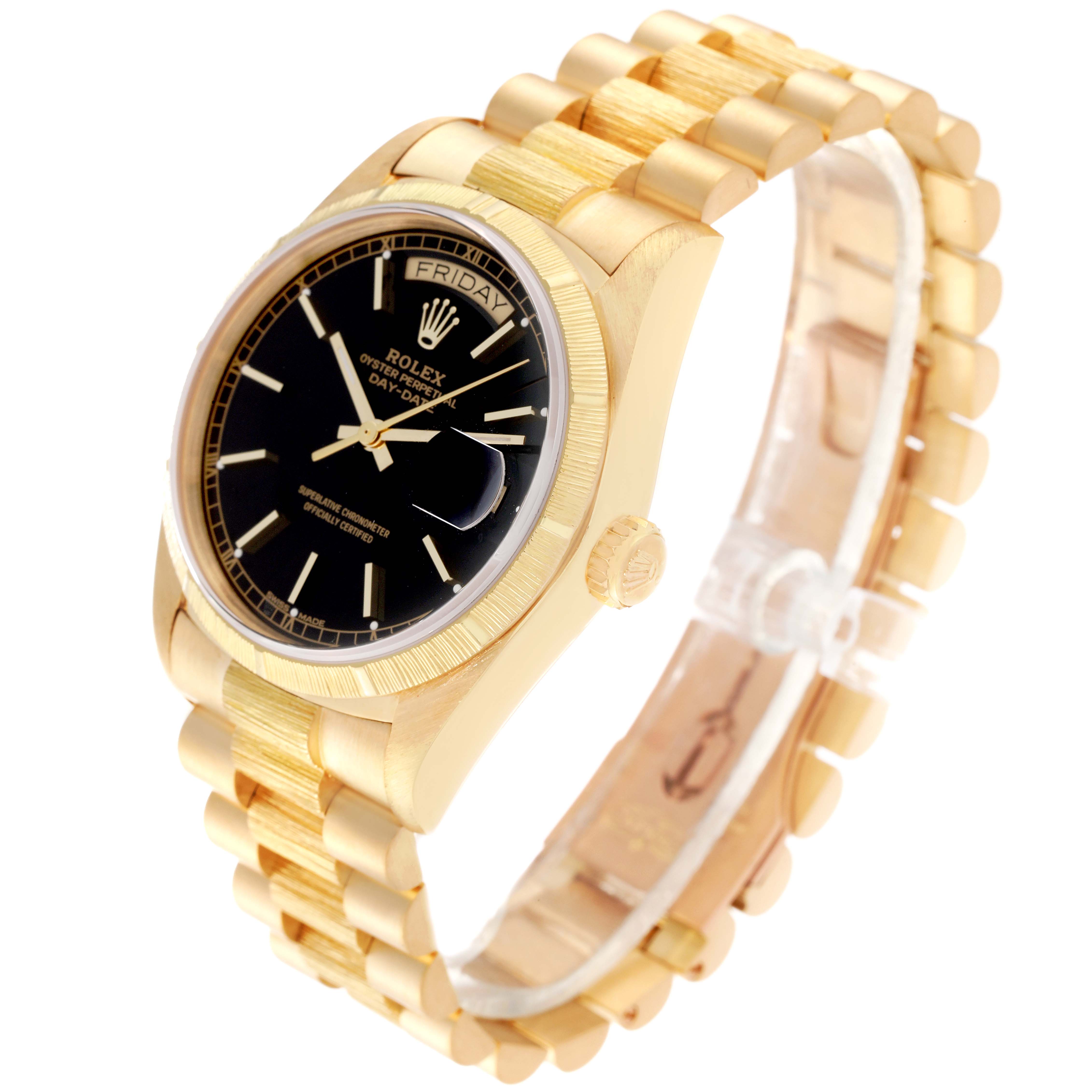 The image shows a side angle of the Rolex President 18078 Men
s Yellow Gold Black Dial 18078 Men
s Yellow Gold Black Dial model watch, featuring its gold bracelet, black face, and day-date display.