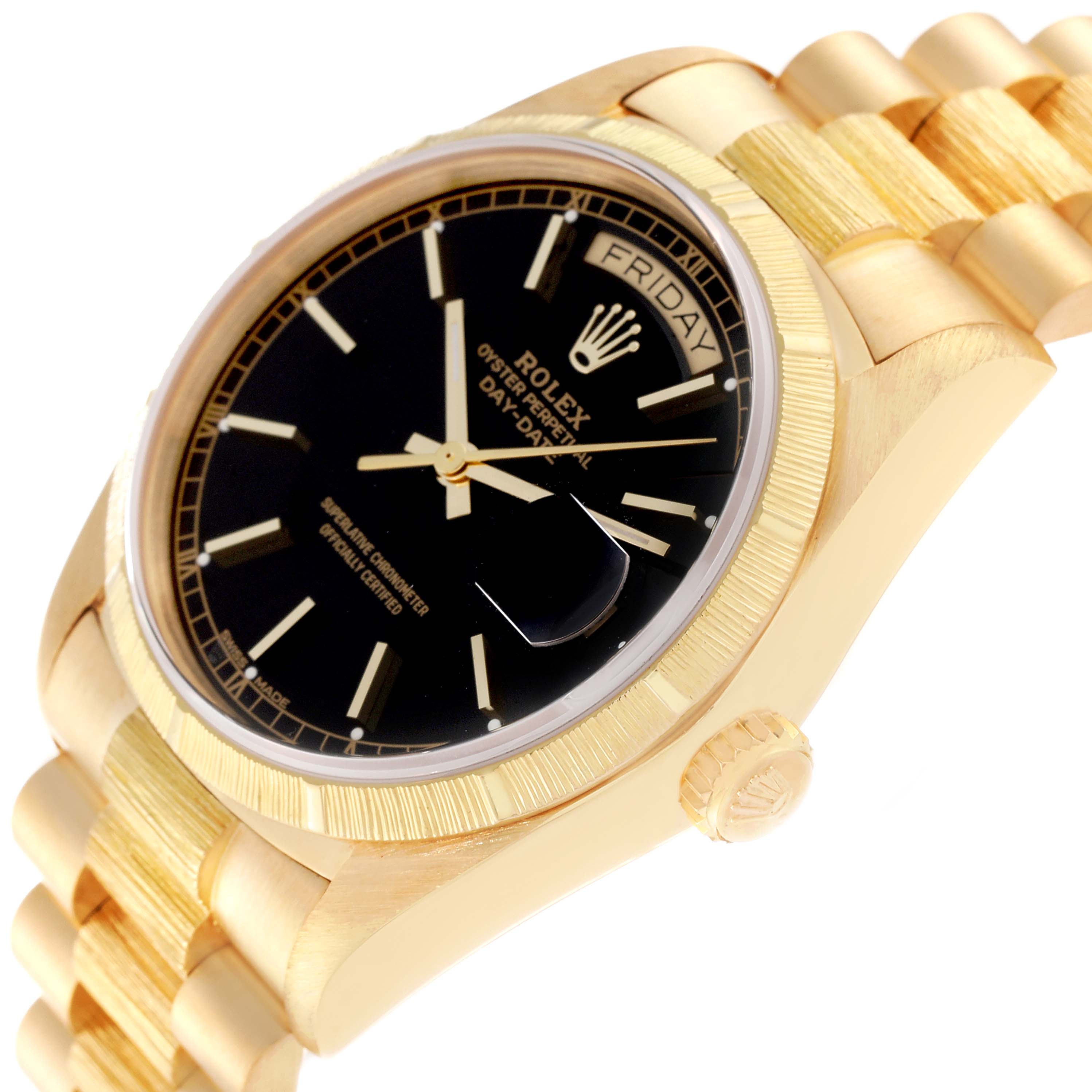This image shows a side angle of a Rolex President 18078 Men
s Yellow Gold Black Dial 18078 Men
s Yellow Gold Black Dial model watch, highlighting its gold bracelet, black dial, crown, and day-date display.