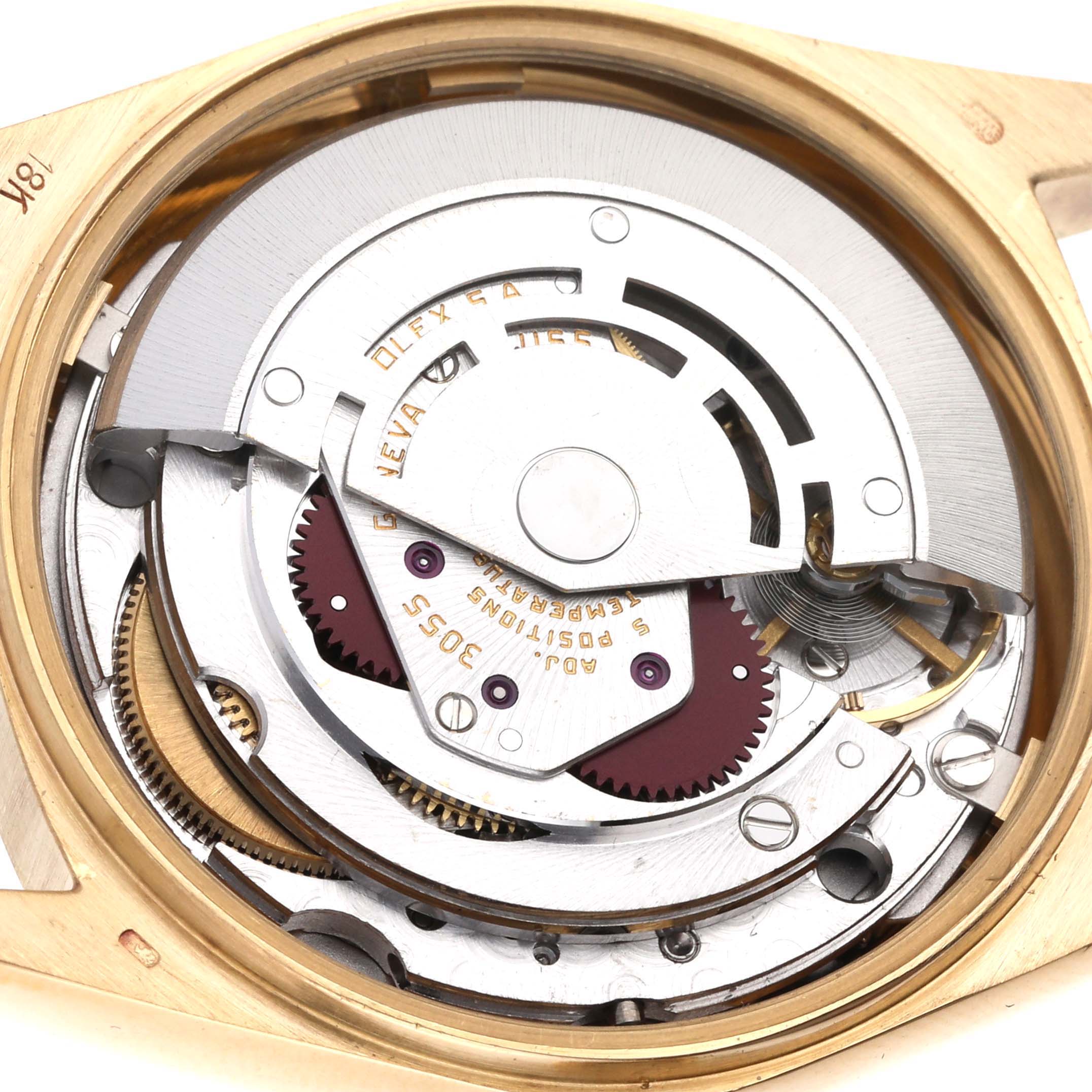 The image shows a close-up view of the internal movement and mechanical parts of a Rolex President 18078 Men
s Yellow Gold Black Dial 18078 Men
s Yellow Gold Black Dial model watch.